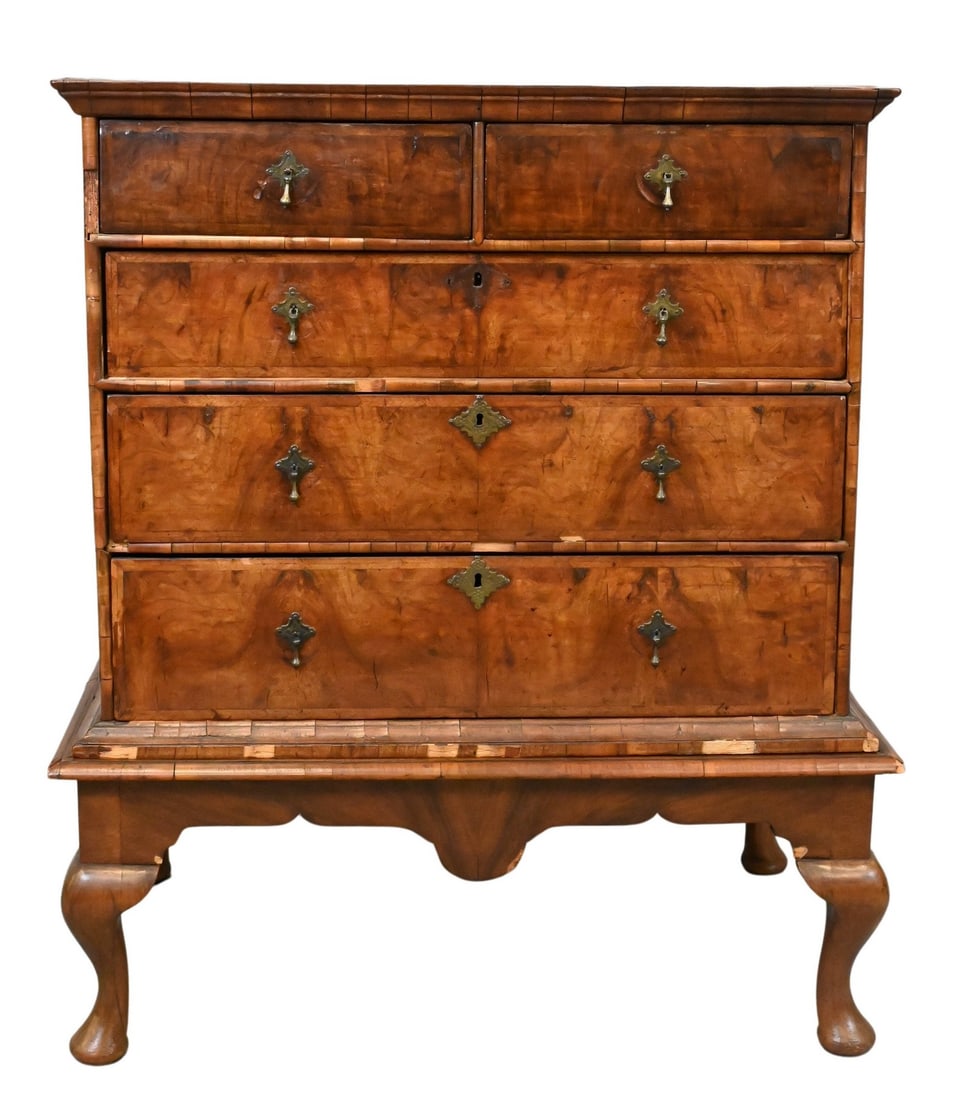 William and Mary Walnut Chest Now on Newer Walnut Base: William and Mary Walnut Chest Now on Newer Walnut Base having early brasses, 18th century, worn, some surface losses height 46 inches, case width 35 1/2 inches Provenance: The Estate of John L. Hughes