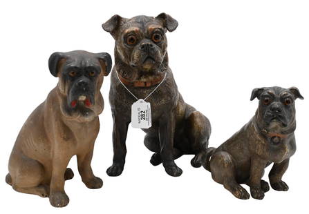 Three Stoneware Ceramic Pugs: Three Stoneware Ceramic Pugs each having textured fur and glass eyes, one seated larger dog with a red collar, one seated small pug with red collar along with one seated boxer tallest height 10 inches