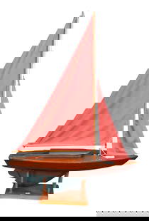 Vintage Pond Boat Model: Vintage Pond Boat Model carved wood and green painted having red sails, inscribed on underside of stand "6th year.....presented 1933" height 33 inches