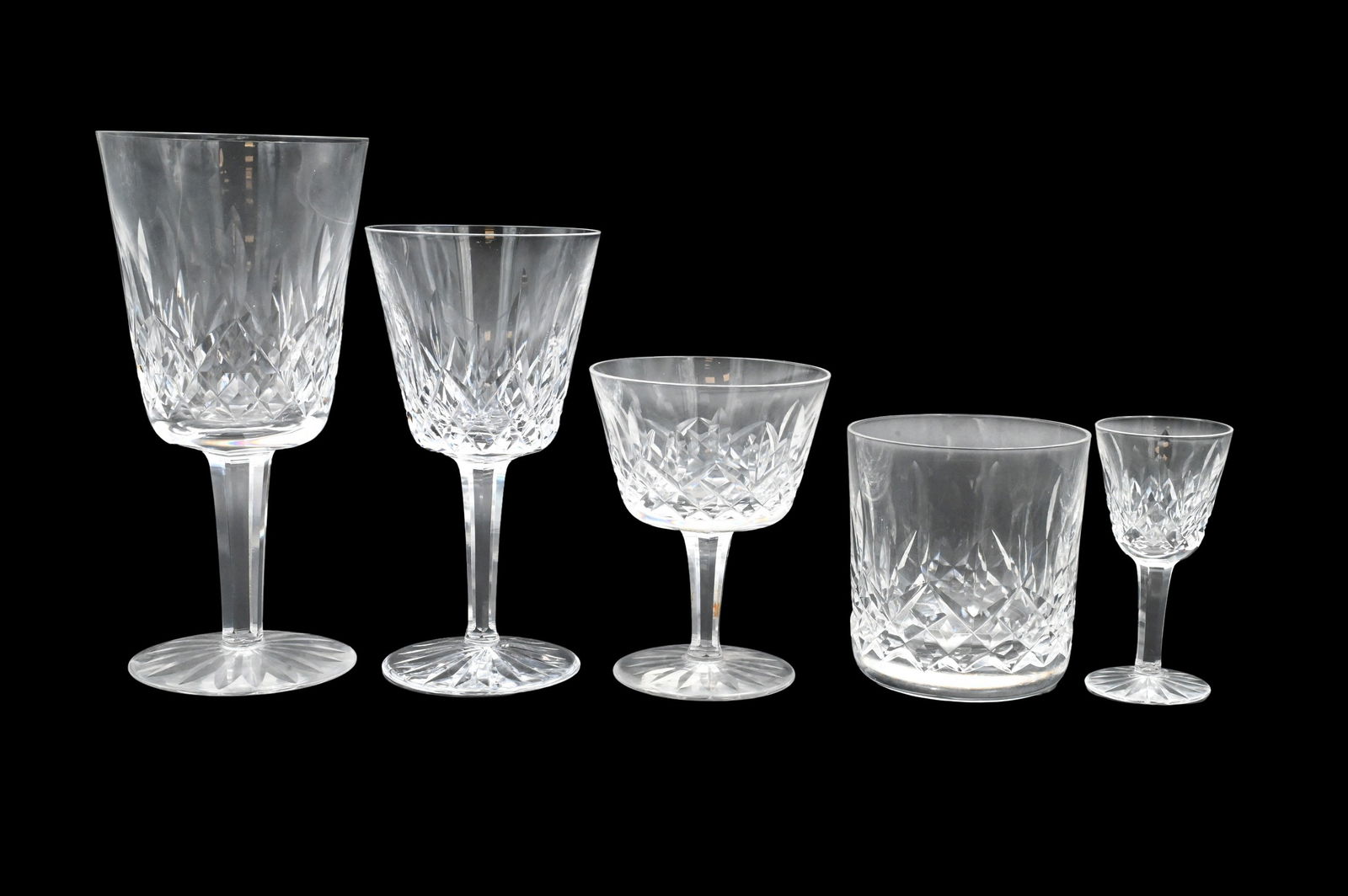 45 Piece Waterford Crystal Group in "Lismore" Pattern: 45 Piece Waterford Crystal Group in "Lismore" Pattern to include 6 water goblets, 8 wine glasses, 2 champagne flutes, 9 cocktail glasses, 6 double old fashions, 6 cordials, 4 salt and pepper shakers,