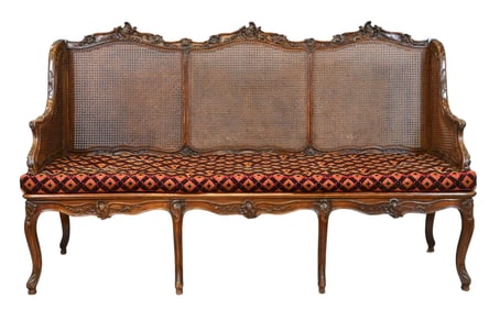 Regency/Louis XV Transitional Walnut Caned Canapé (France 18th Century)