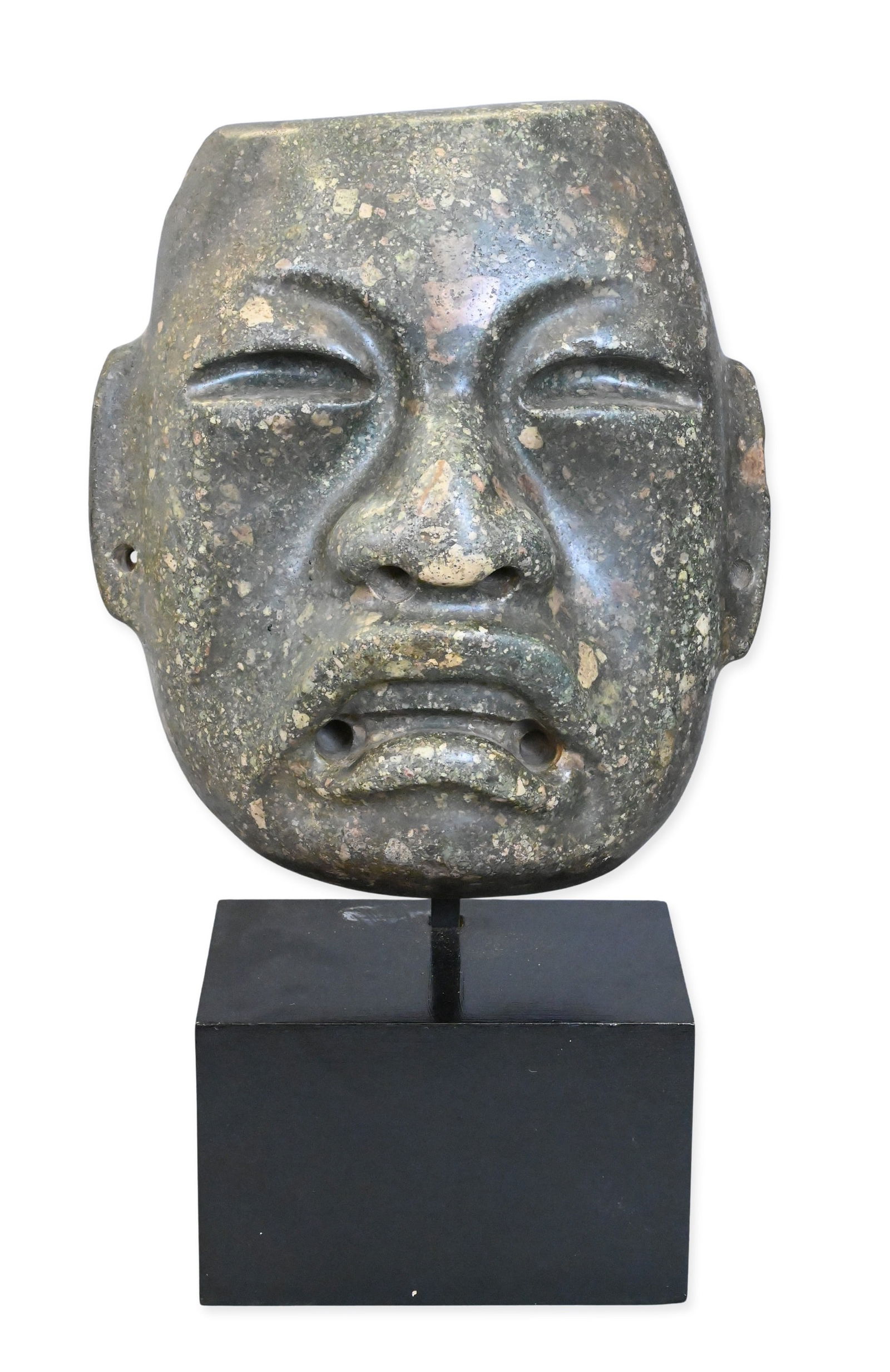Large Carved and Polished Olmec Grey-Green Stone Mask: Large Carved and Polished Olmec Grey-Green Stone Mask imposing mask carved in the Olmec style, with crescent-shaped eye slits, a broad nose, and an open downturned mouth in a pale grey-green conglomer