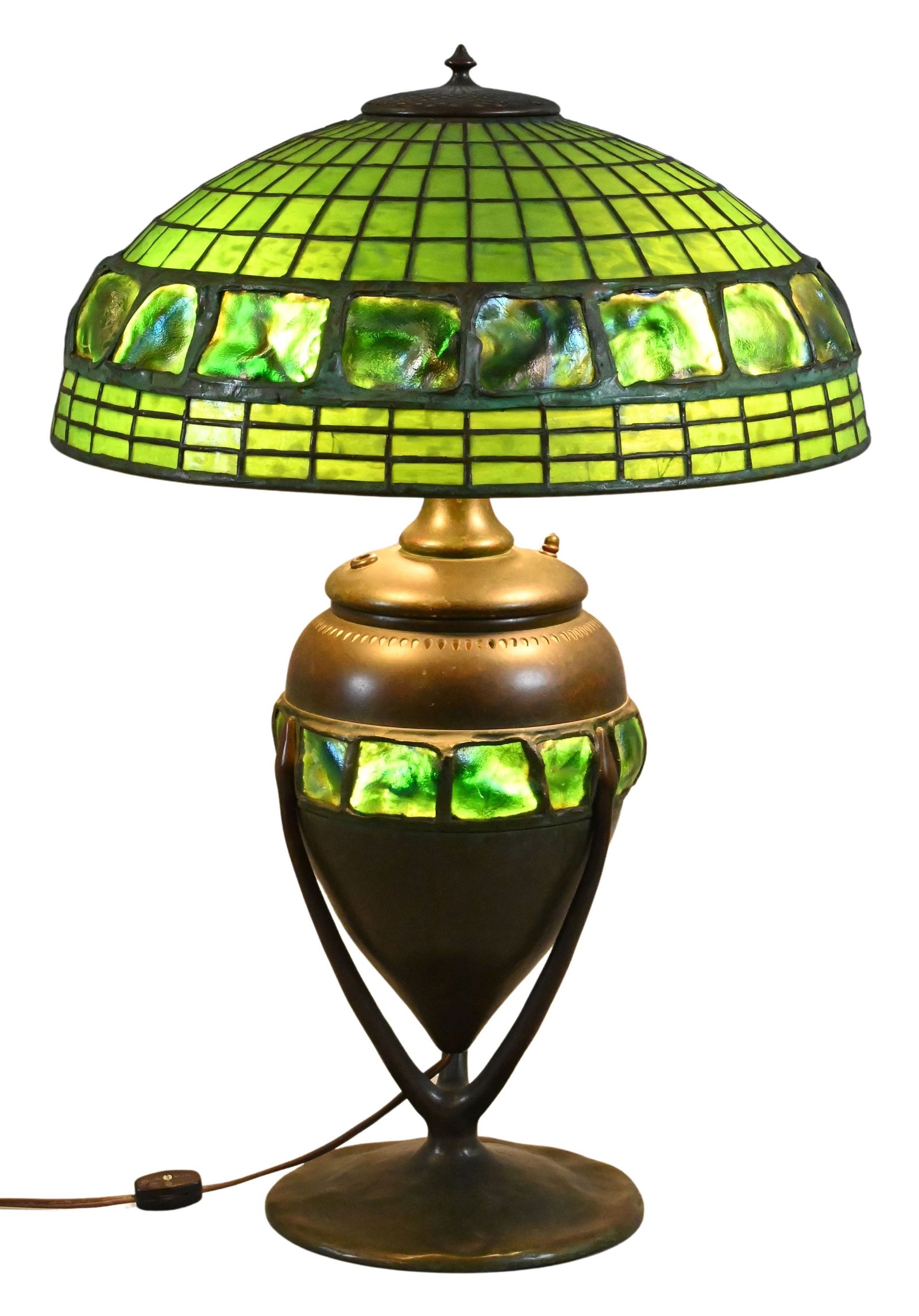 Tiffany Studios “Turtleback Tile” Table Lamp: Tiffany Studios “Turtleback Tile” Table Lamp the domed leaded-glass shade composed of geometric green favrile panels surmounted by a band of iridescent favrile “turtleback” tiles displ