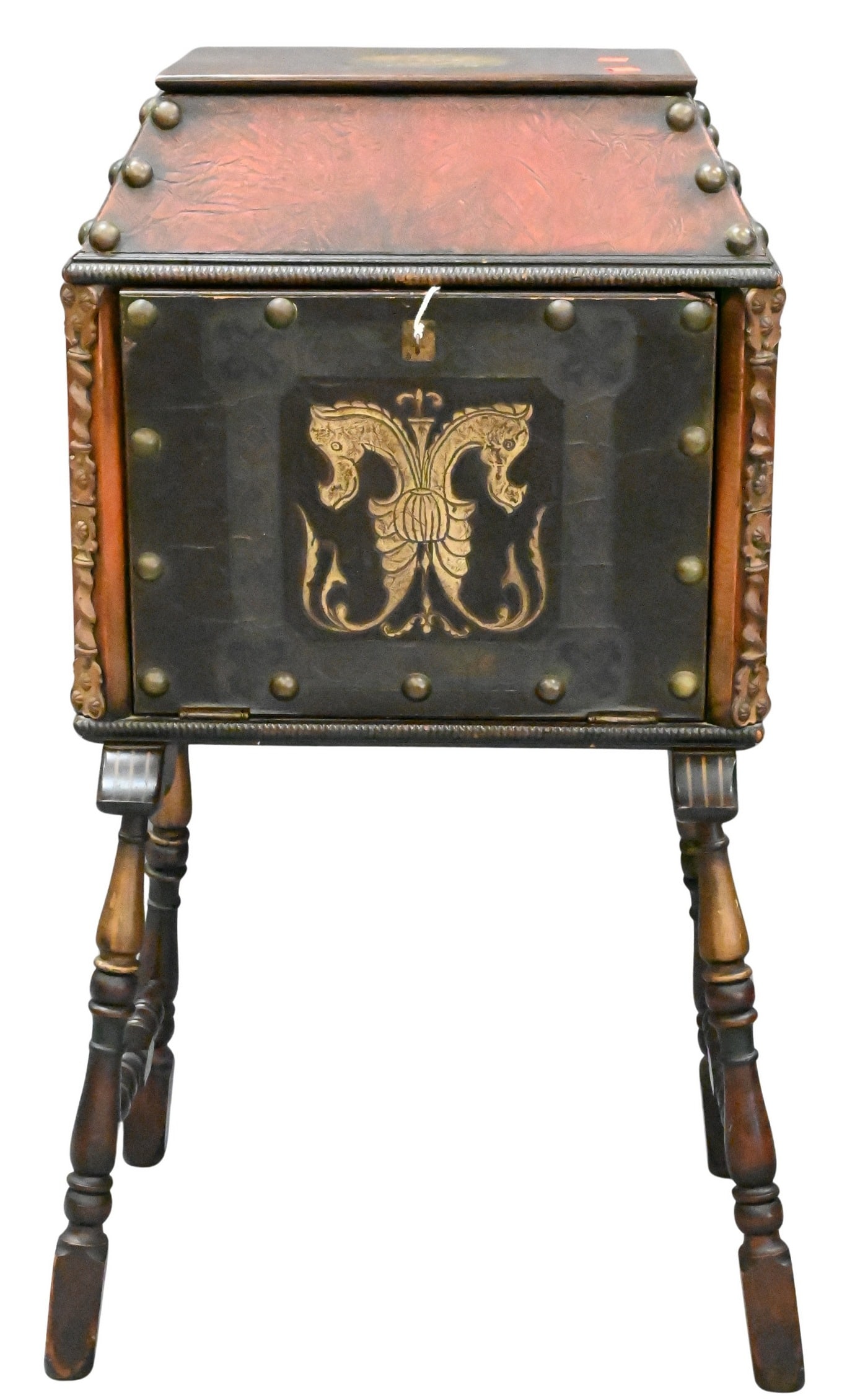 Spanish Revival Lift Top Humidor: Spanish Revival Lift Top Humidor leather bound opening to top copper compartment, drop front over turned legs, featuring seahorse and ship motif, paper label to underside, circa 1920 37 1/2 13 19