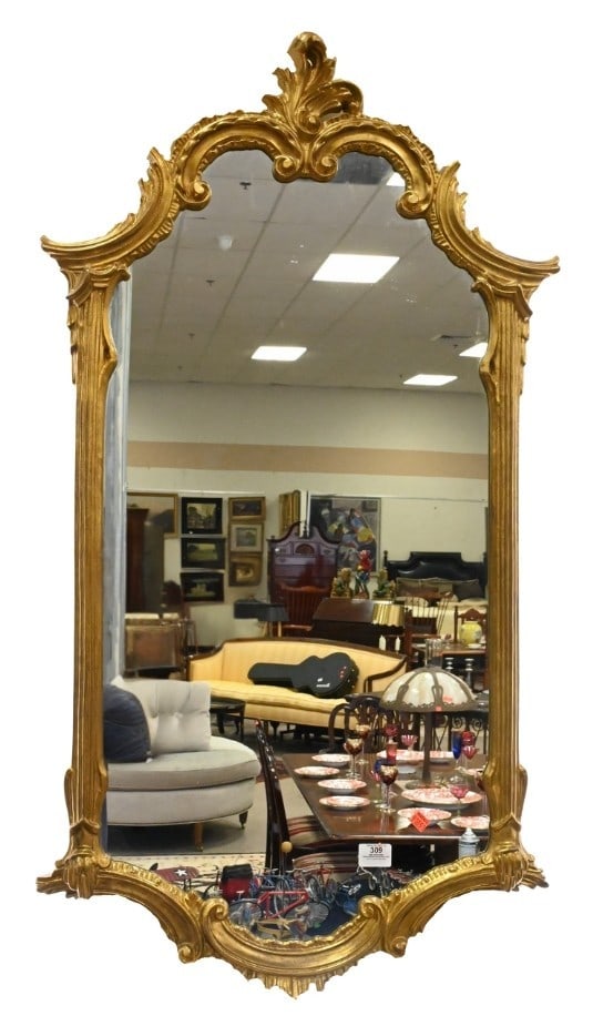 Ornate French Style Giltwood Mirror: Ornate French Style Giltwood Mirror having fluted column form border ending in scrolling foliate and acanthus leaf design 44" x 24" Provenance: From an Upper East Side, Fifth Avenue Apartment