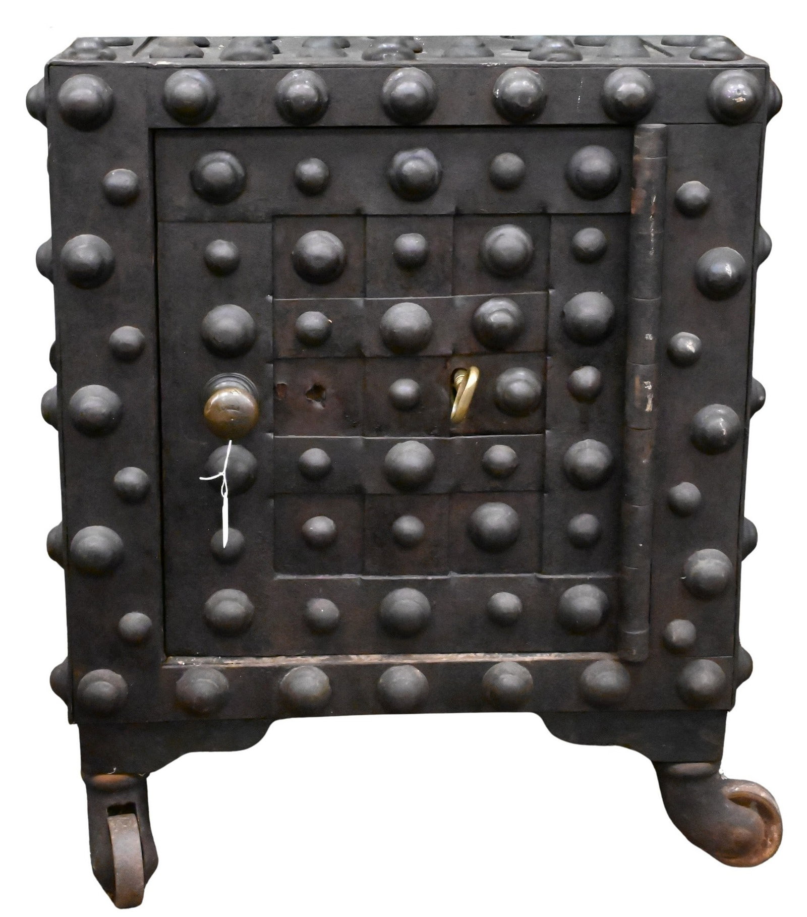 Jesse Delano Hobnail Safe: Jesse Delano Hobnail Safe interior having original manufacturing label and shelving, set on four rolling casters, having custom glass top, decorative hobnails height 29 inches, 22" x 23"