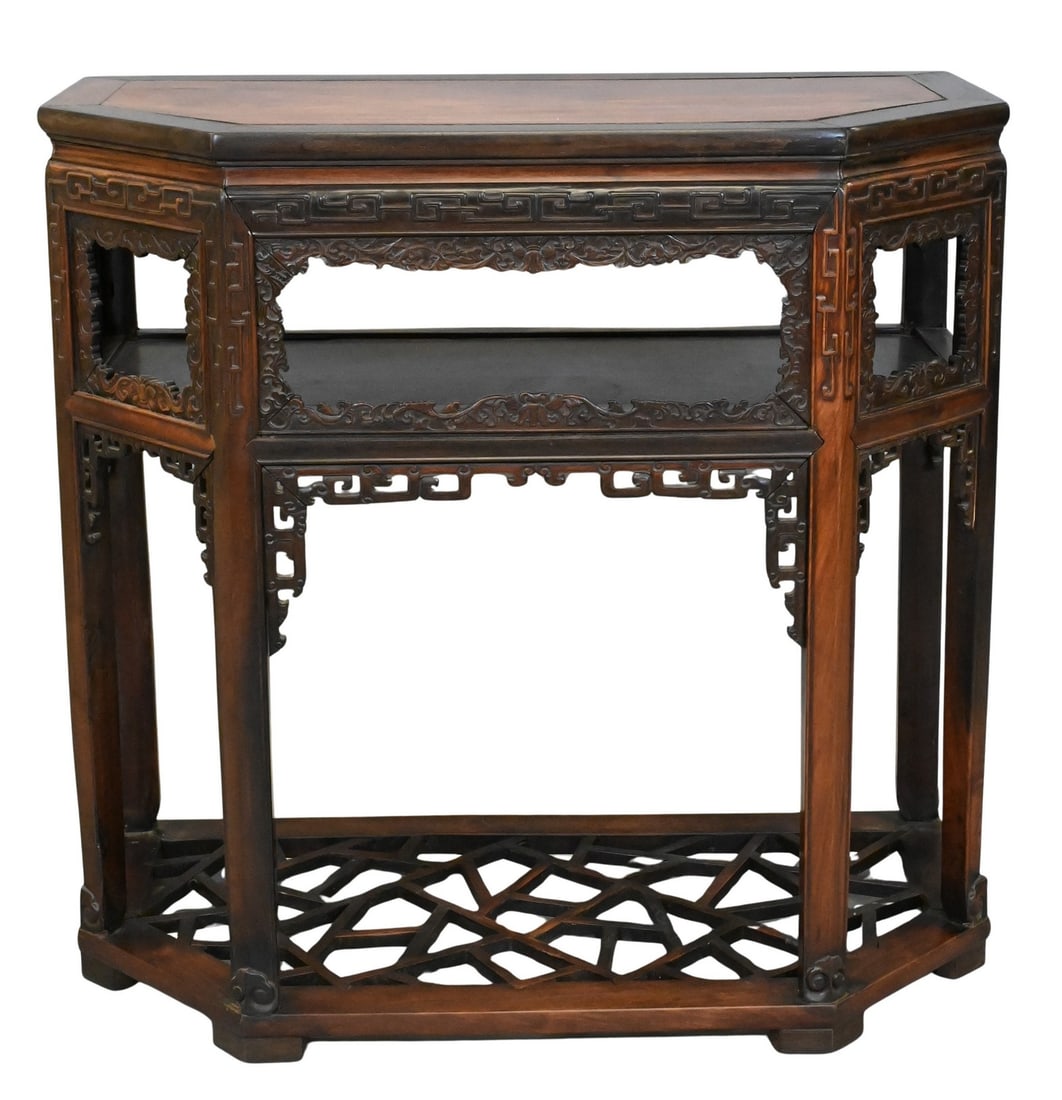 Chinese Carved Hardwood Console Table: Chinese Carved Hardwood Console Table 19th Century The rectangular top over a frieze pierced and carved with scrolling foliage and key-fret borders, fitted with an open shelf and raised on square legs