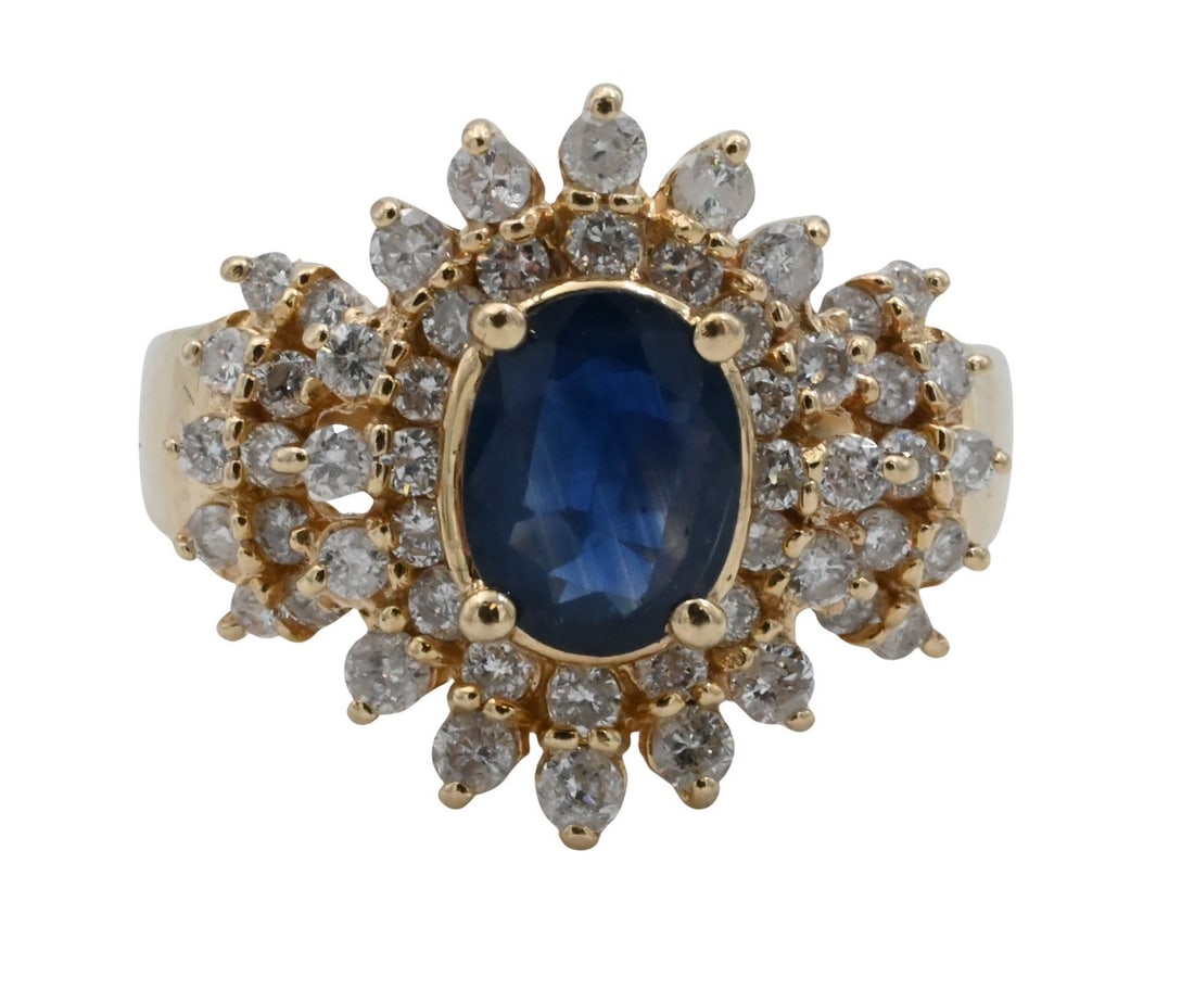 14K Yellow Gold, Sapphire, and Diamond Ring: 14K Yellow Gold, Sapphire, and Diamond Ring Ring centering an oval-cut blue sapphire measuring approximately 6.1 × 8.1 mm, surrounded by twenty-four round brilliant-cut diamonds in a tiered clust