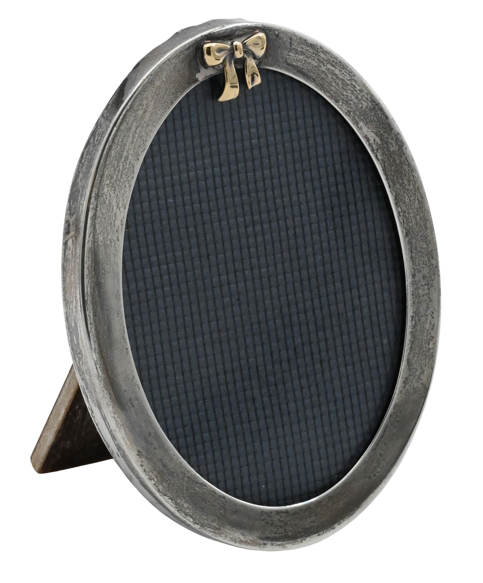 Tiffany & Co. Sterling Silver Oval Picture Frame: Tiffany & Co. Sterling Silver Oval Picture Frame Elegant oval-form frame with polished sterling silver border surmounted by a tied ribbon and bow motif, fitted with original fabric backing and wood ea