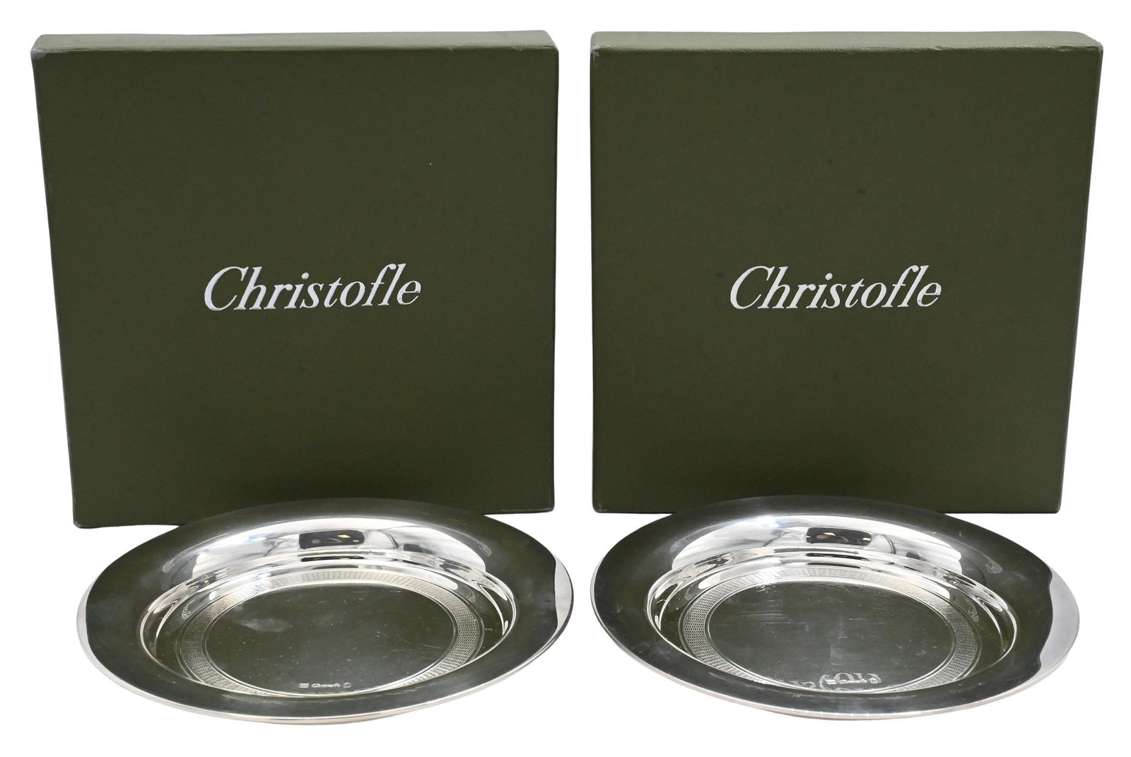 Pair of Christofle Silver Plate Wine Coasters: Pair of Christofle Silver Plate Wine Coasters having chased ring center, each with Michael C. Fina 5th Avenue New York dust covers and original Christofle boxes diameter 5 3/4 inches