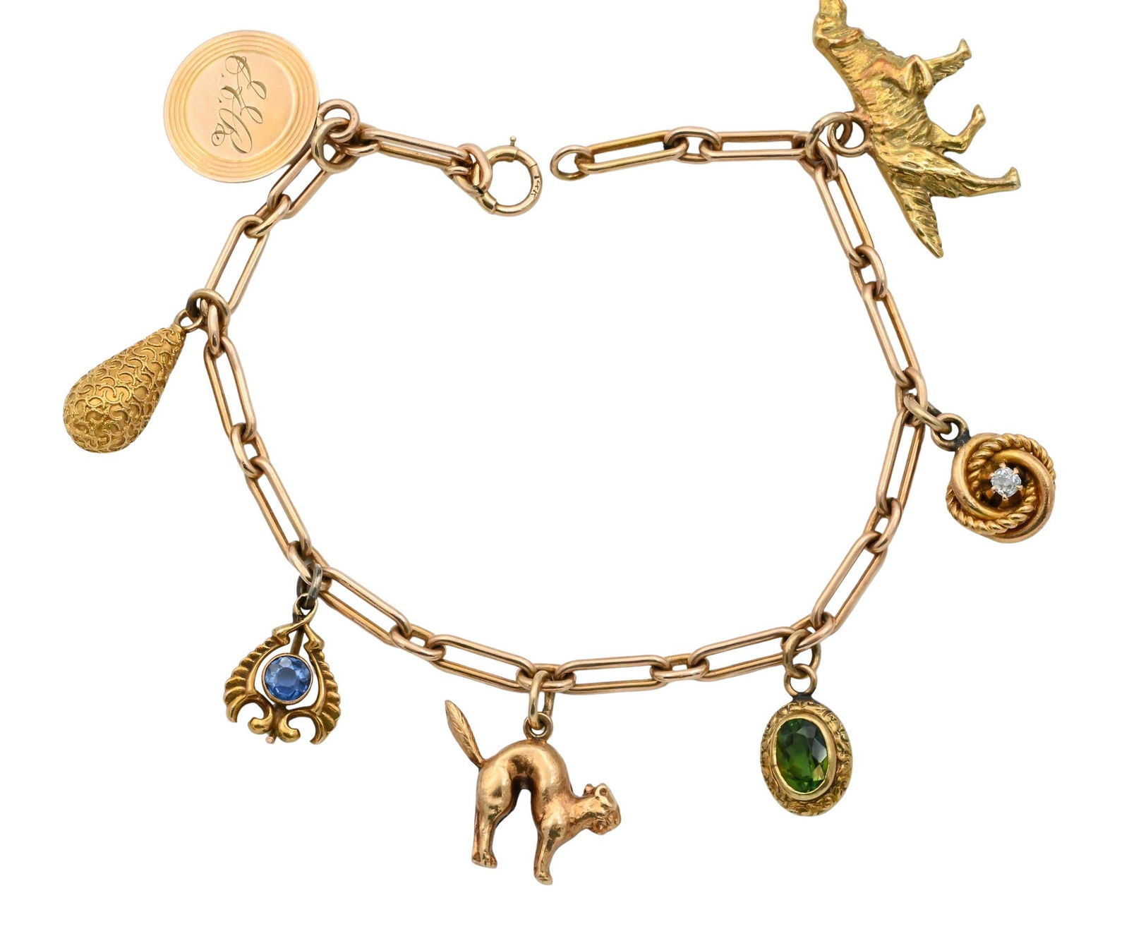 14K Yellow Gold Charm Bracelet: 14K Yellow Gold Charm Bracelet having seven charms to include a dog and cat, three charms set with stones including a diamond and one drop form length 7 inches, total weight 14.5 grams
