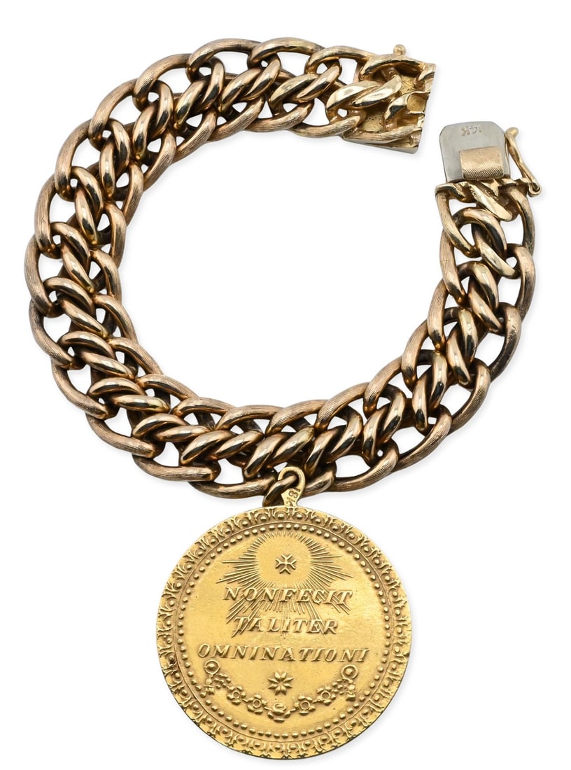 14K Yellow Gold Charm Bracelet: 14K Yellow Gold Charm Bracelet having 18K Lady of Guadalupe medallion, suspended from a heavy 14K gold link bracelet total weight 54.63 grams Provenance: From a Park Avenue, New York Estate
