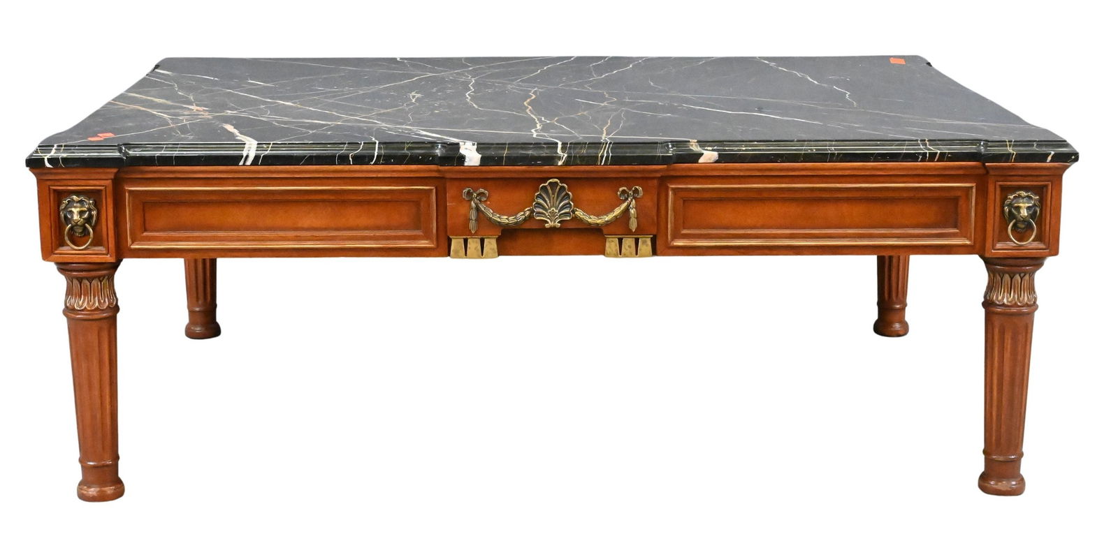Henredon Marble Top Coffee Table: Henredon Marble Top Coffee Table having corner lion masks over fluted legs, labeled on underside height 20 inches, top 39" x 55" Provenance: From an Upper East Side, Fifth Avenue Apartment