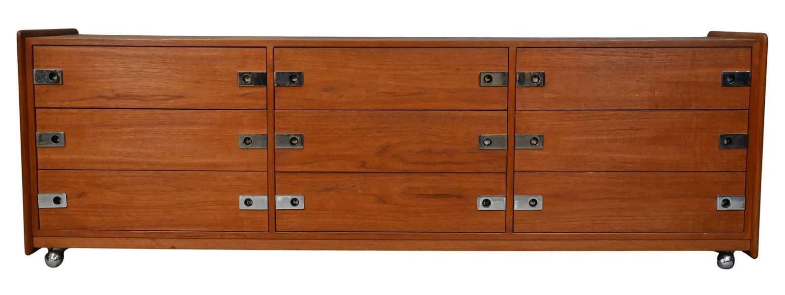 In the Manner of Arne Vodder Mid-Century Modern Teak Credenza Triple Dresser: In the Manner of Arne Vodder Mid-Century Modern Teak Credenza Triple Dresser having nine drawers and set on castors height 25 inches, top 19" x 77"