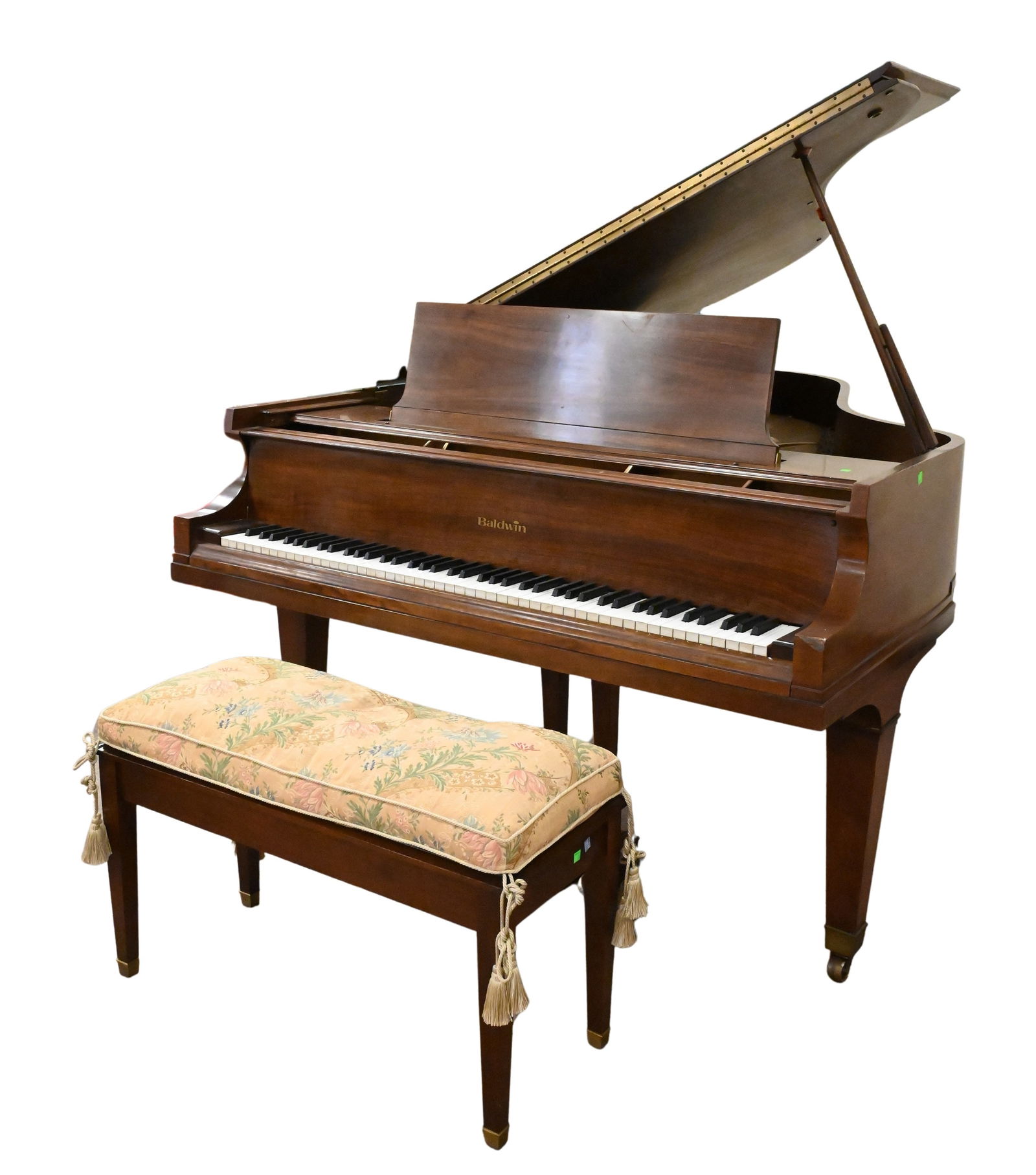 Baldwin Mahogany Grand Piano: Baldwin Mahogany Grand Piano serial number 223037, along with matching bench having upholstered top length 76 inches