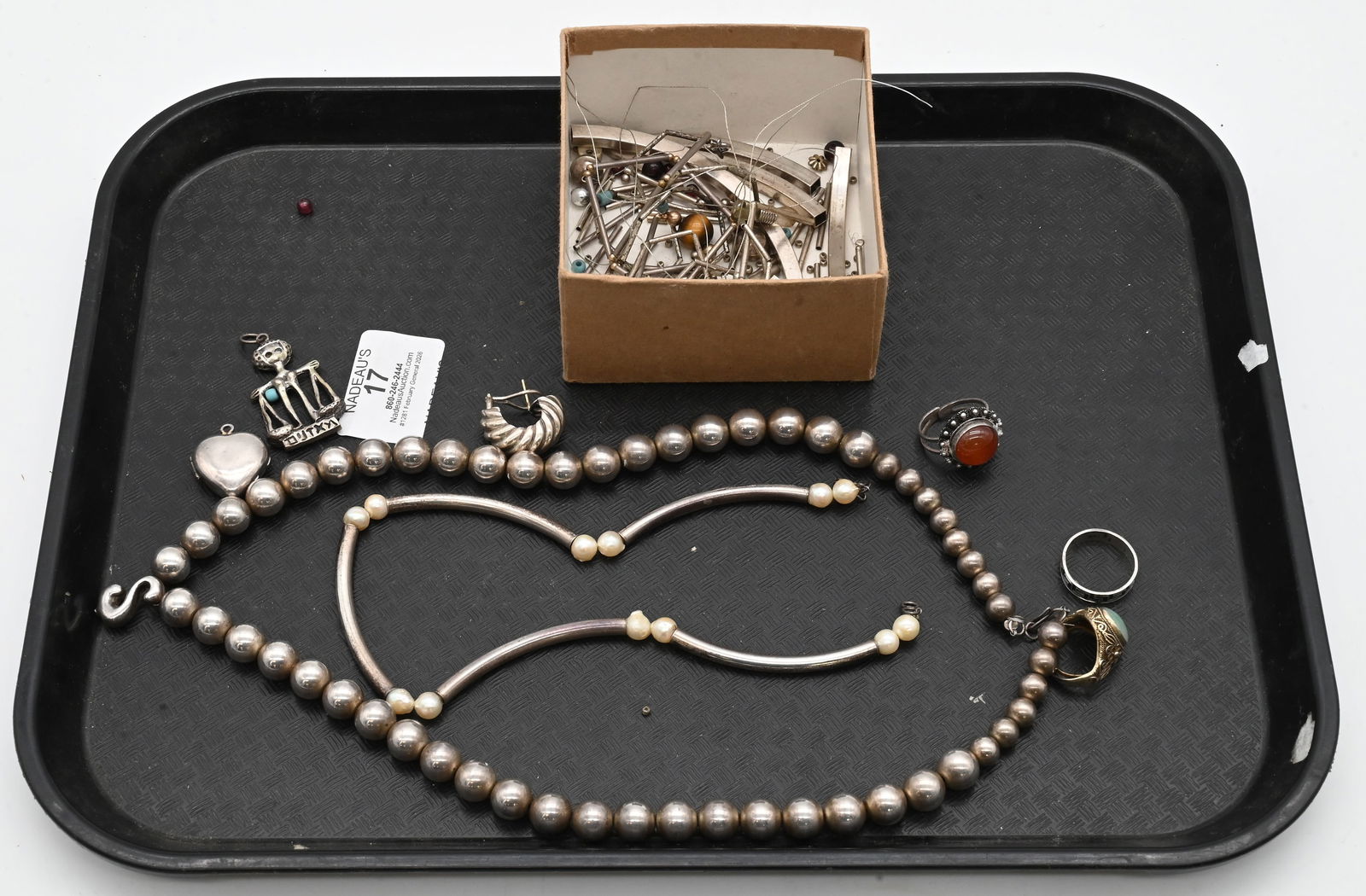 Group of Silver Jewelry: Group of Silver Jewelry to include rings, locket, charms, necklace, and other broken piece of jewelry