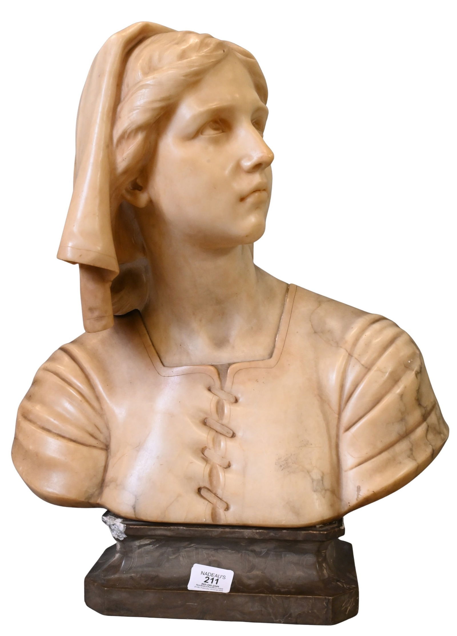 After Giuseppe Bessi (Italian 1857-1922): After Giuseppe Bessi (Italian 1857-1922) "Jeanne D'Arc" Portrait Bust of Joan of Arc Veined alabaster on pedestal base (chipped corner to base) Signed on verso G.Lili Bust height 17 1/2 inches