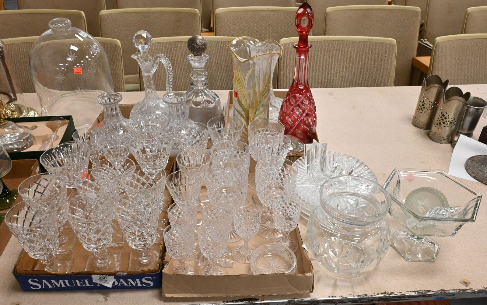 Five Tray Lots of Assembled Glassware: Five Tray Lots of Assembled Glassware to include cut glass stems, decanters, one with sterling silver stopper, cranberry cut to clear decanter, Tiffany crystal vase, three Steuben plates with etched