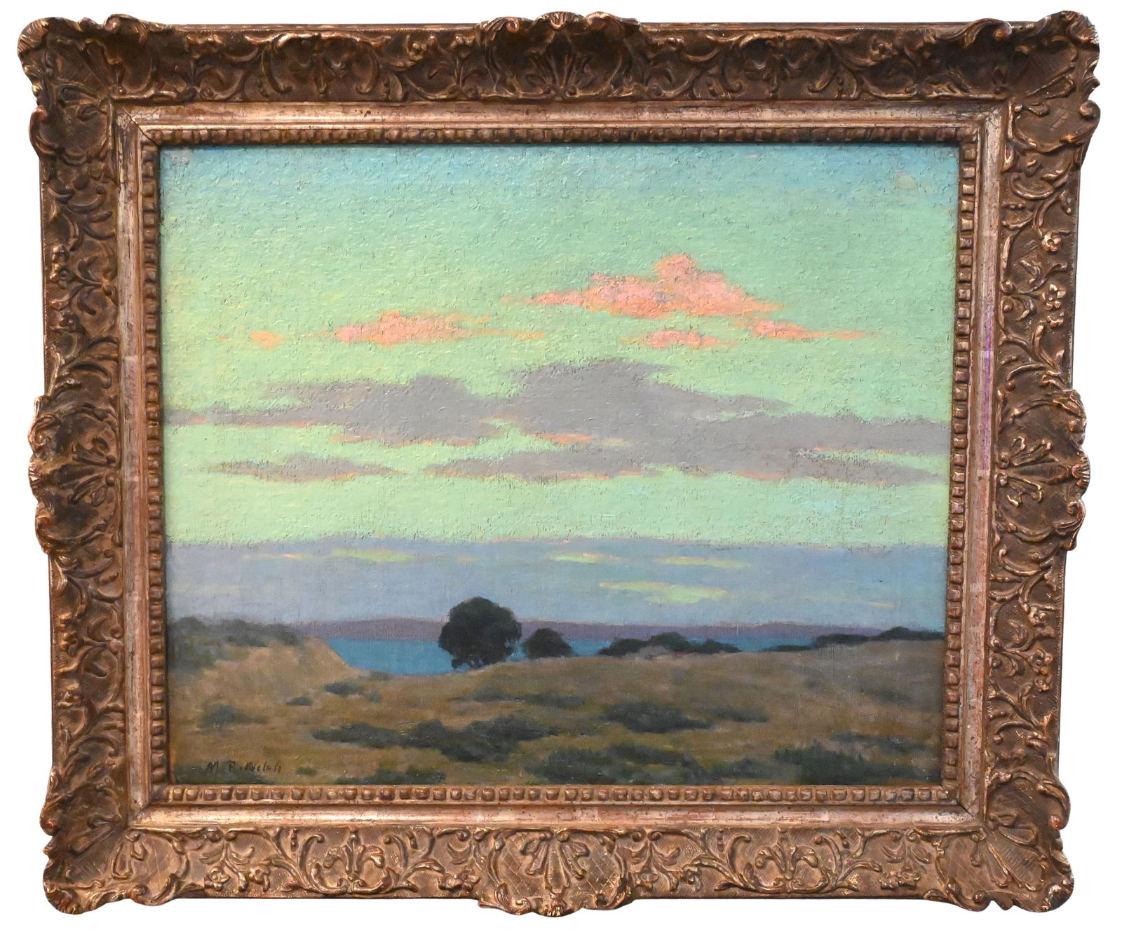 Mabel R. Welch (American 1871-1959): Mabel R. Welch (American 1871-1959) "Vivid Sunset" Oil on canvas Depicting a tranquil landscape at dusk, with rolling hills and scattered trees leading toward a distant body of water beneath a luminou