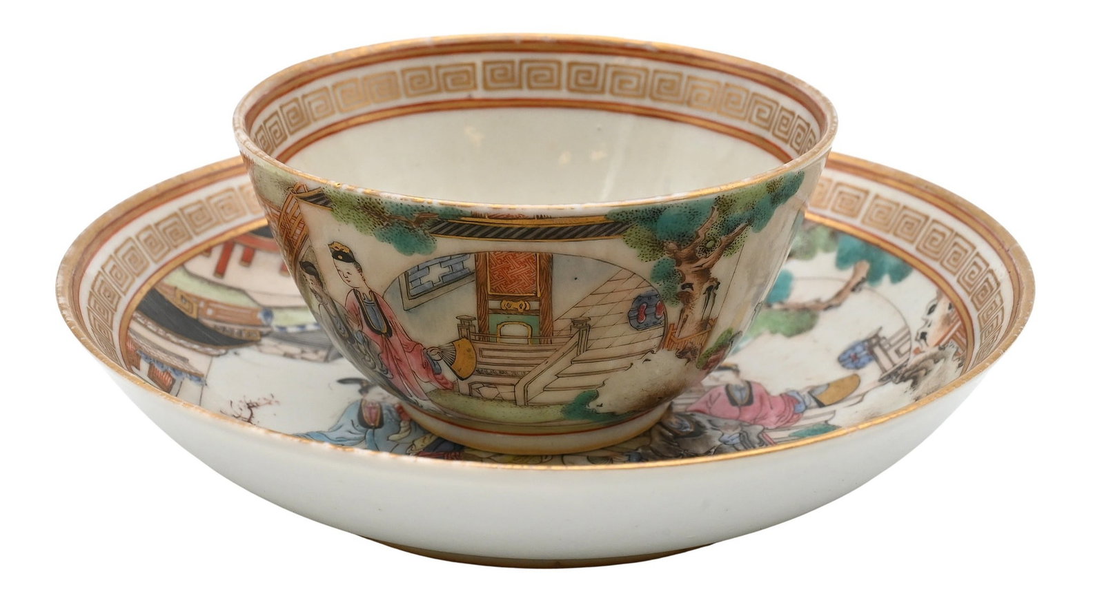 Chinese Export Porcelain Teacup and Saucer: Chinese Export Porcelain Teacup and Saucer featuring geishas and scholars in a courtyard landscape bordered by gilt diaper motif rim, cup centered by gilt floral medallion, circa 18th century 