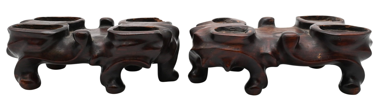 Pair of Chinese Carved Wood Stands: Pair of Chinese Carved Wood Stands each of organic, root-form design having shaped supports and inset top recesses for display of four footed animals, raised on short feet length 6 inches 