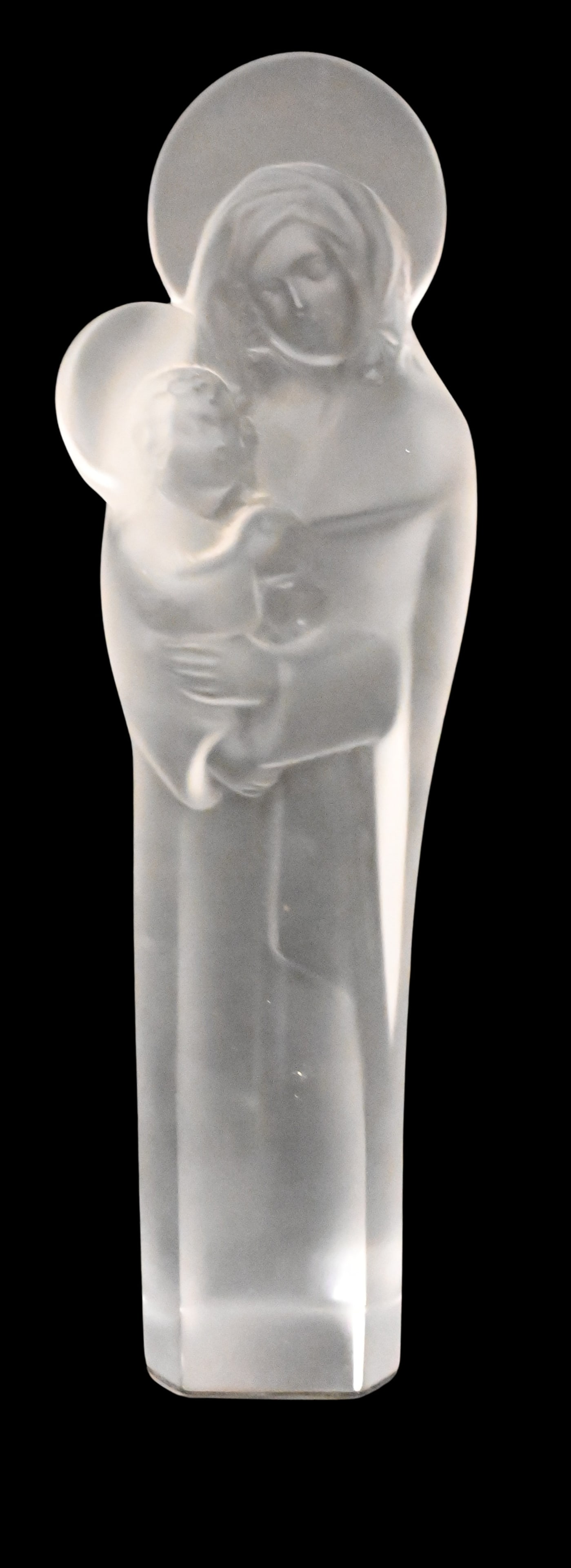 Lalique Frosted Crystal Madonna and Child: Lalique Frosted Crystal Madonna and Child depicting the Virgin Mary holding the Christ child both in halos, signed "Lalique France" in engraved script on the lower side, on black lacquered base 