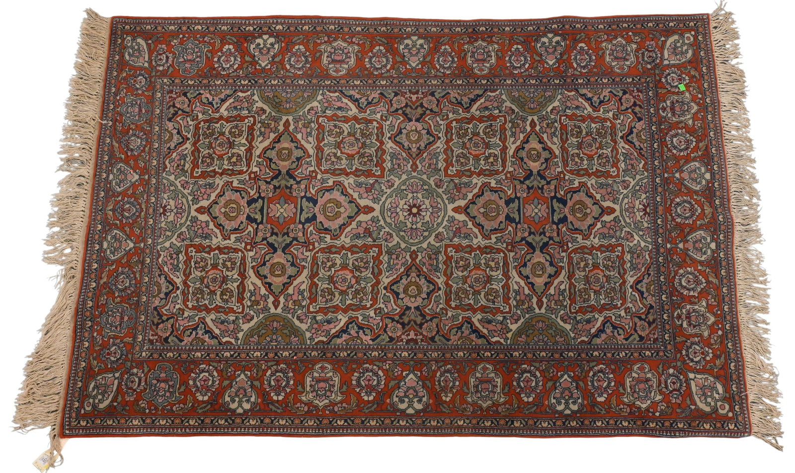 Central Persian Rug: Central Persian Rug having two pole medallions set against an ivory ground, in a bright red outer border, probably Isfahan, early 20th century 4' x 6' 6" Provenance: Property of Mr. and Mrs. John