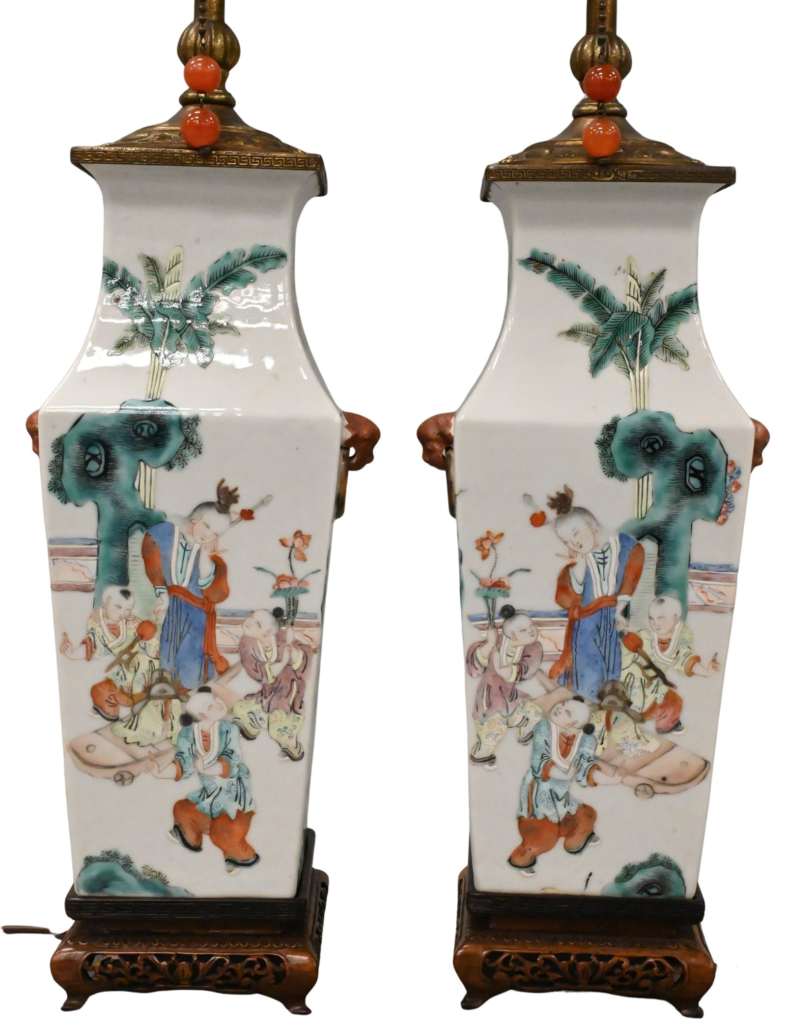Pair of Chinese Porcelain Vases Mounted as Lamps: Pair of Chinese Porcelain Vases Mounted as Lamps having square form lion masks, amber style pulls, pierce carved bases, adjustable, 19th century vase height 11 inches Provenance: Property of Mr. and M