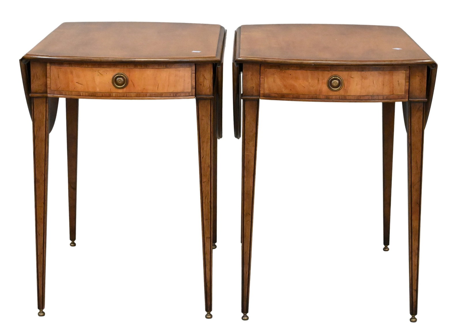 Pair of Federal Style Pembroke Tables: Pair of Federal Style Pembroke Tables Each having a rectangular top featuring two drop leaves above a single frieze drawer, raised on square tapering legs terminating in brass caps and casters 