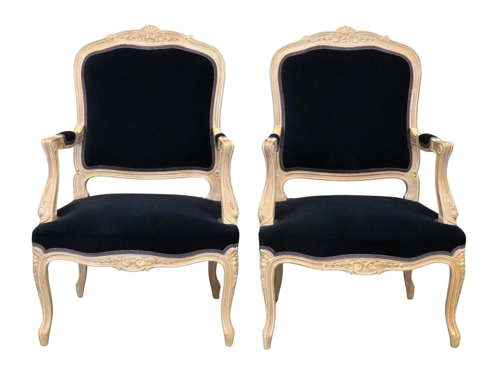 Pair of Louis XV Style Fauteuils: Pair of Louis XV Style Fauteuils having shaped crest floral carving, seat upholstered in dark blue velvet, scrolling open arms and carved supports, raised on cabriole legs height 40 inches, width