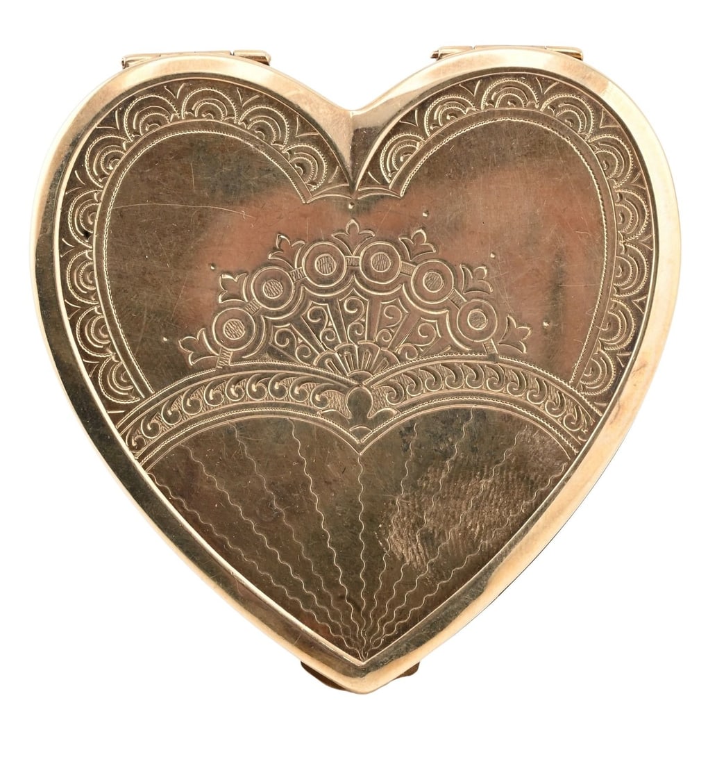10K Yellow Gold Heart-Form Compact: 10K Yellow Gold Heart-Form Compact Early 20th century heart-shaped compact with engine-turned and engraved decoration, the lid centering a foliate cartouche with monogram, opening to a fitted interior