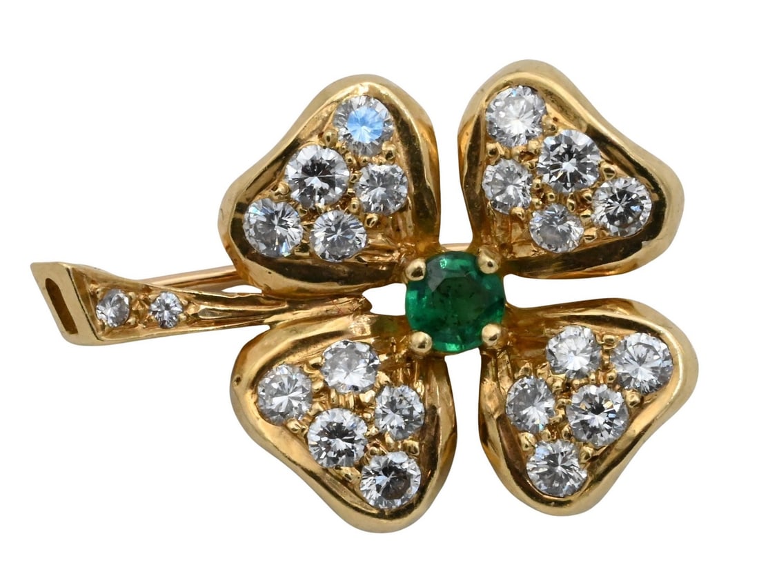 18K Yellow Gold Clover-form Brooch: 18K Yellow Gold Clover-form Brooch centering one round emerald the petals and stem accented by twenty-two round brilliant-cut diamonds totaling approximately 0.75 ct., total weight approximately 2.7