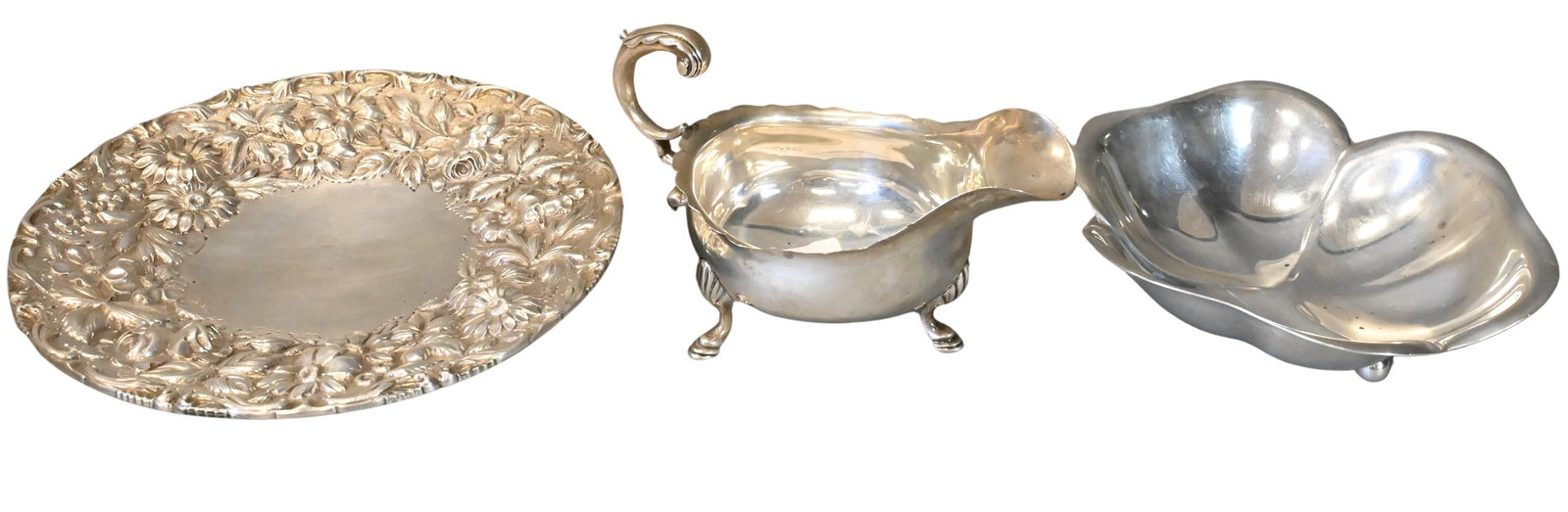 Three Piece Sterling Silver Group: Three Piece Sterling Silver Group to include Georgian gravy boat, Reed & Barton clover form bowl, and Jenkins & Jenkins rose and sunflower repousse tray largest 8 1/2 inch diameter