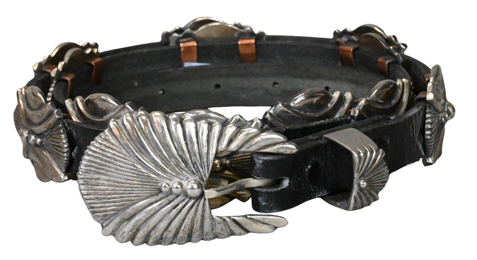David Dear (Native American 20th/21st Century): David Dear (Native American 20th/21st Century) Roswell Southwest Deco Concho Belt, 1985 Sterling silver and leather belt featuring 12 main sterling conchas Signed and marked Dear '85 .925 Length 47