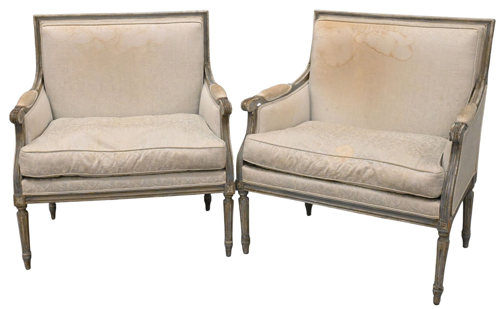 Pair of Louis XVI Style Bergeres: Pair of Louis XVI Style Bergeres upholstered armchairs, carved wood framed over fluted legs height 35 inches, width 33 inches, depth 22 inches
