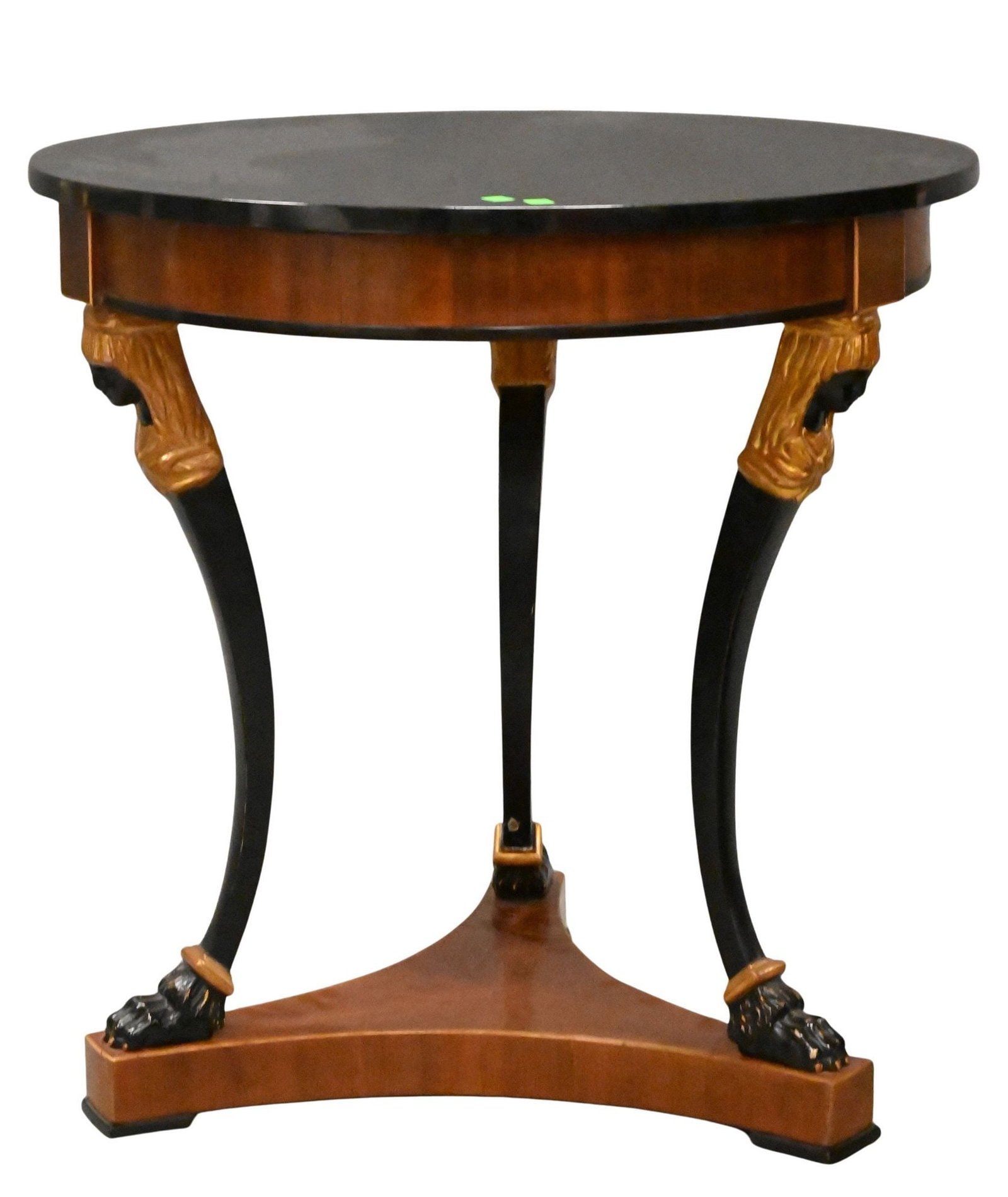Neoclassical Round Table: Neoclassical Round Table having black marble top with figural carved supports and paw feet height 29 inches, diameter 28 1/2 inches