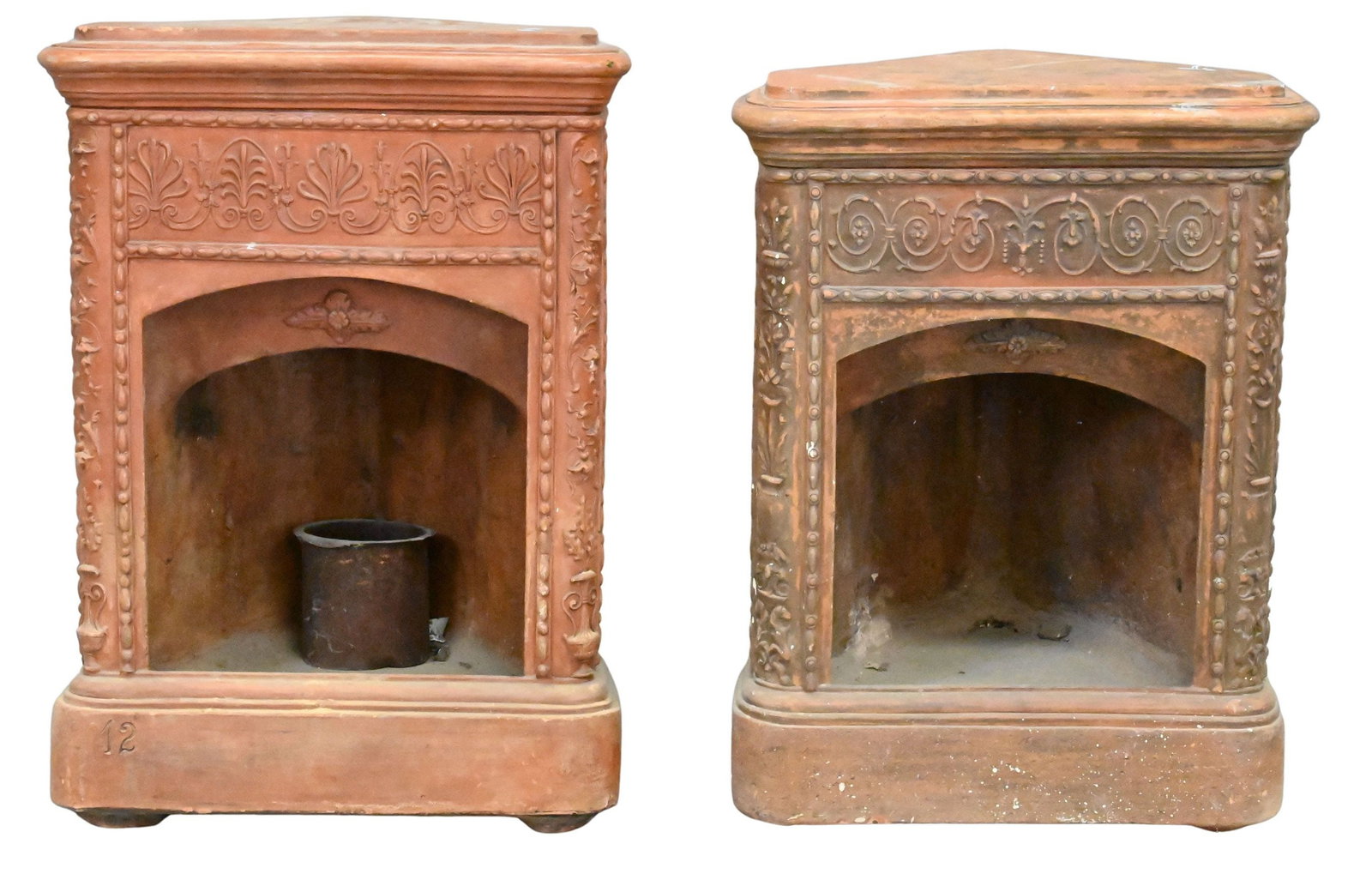 Near Pair of Terracotta Stoves made into End Tables: Near Pair of Terracotta Stoves made into End Tables possibly Portuguese, having decorative fronts height 34 inches, width 25 inches, depth 19 1/2 inches
