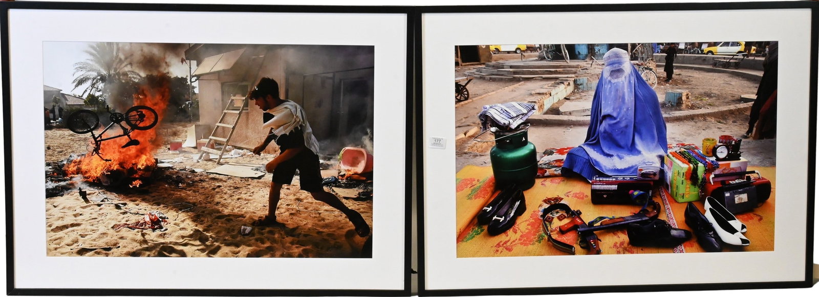 Five: Spencer Platt (American B.1970): Five: Spencer Platt (American B.1970) "Baghdad, Iraq, Market, 04/16/2003 " "Kabul, Afghanistan, Market Woman with Gun, 11/21/2001" "Resistance to Eviction, Gaza, 08/17/2005" "On the Fence Between