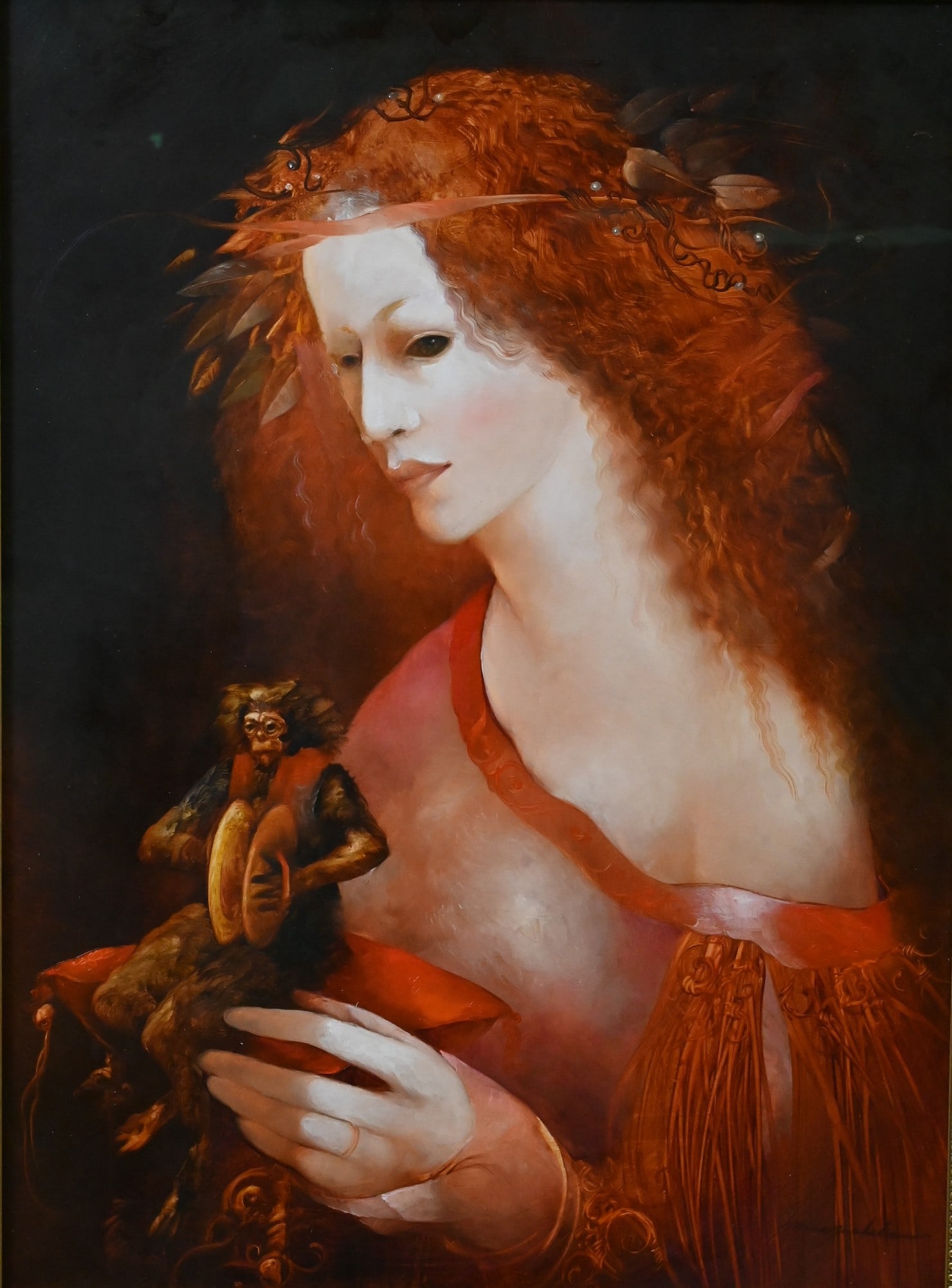 Anne Bachelier (French B.1949): Anne Bachelier (French B.1949) Portrait of a Red Haired Woman Oil on board depicting surrealist-style portrait depicting a red-haired female figure holding a small cymbal-playing monkey Signed lower