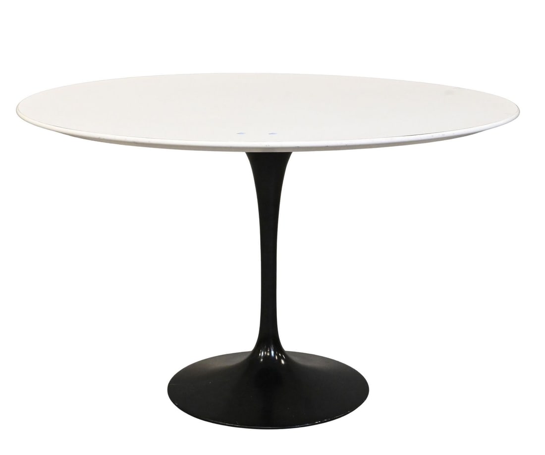 Eero Saarinen for Knoll Tulip Table: Eero Saarinen for Knoll Tulip Table having white laminate over wood round top set on black enameled aluminium base height 28 1/2 inches, diameter 47 inches Reference: Current comparable examples retai