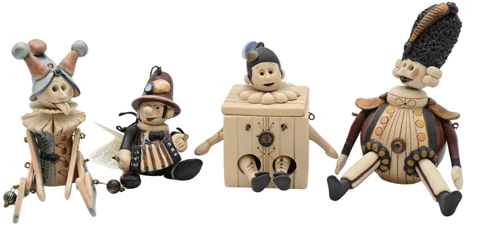 Collection of 58 Laboratorio Pesaro "I Pupi" Figures: Collection of 58 Laboratorio Pesaro "I Pupi" Figures articulating ceramic puppet ornaments depicting, harlequins, devils, soldiers etc...each with original labels tallest 5 inches Provenance: