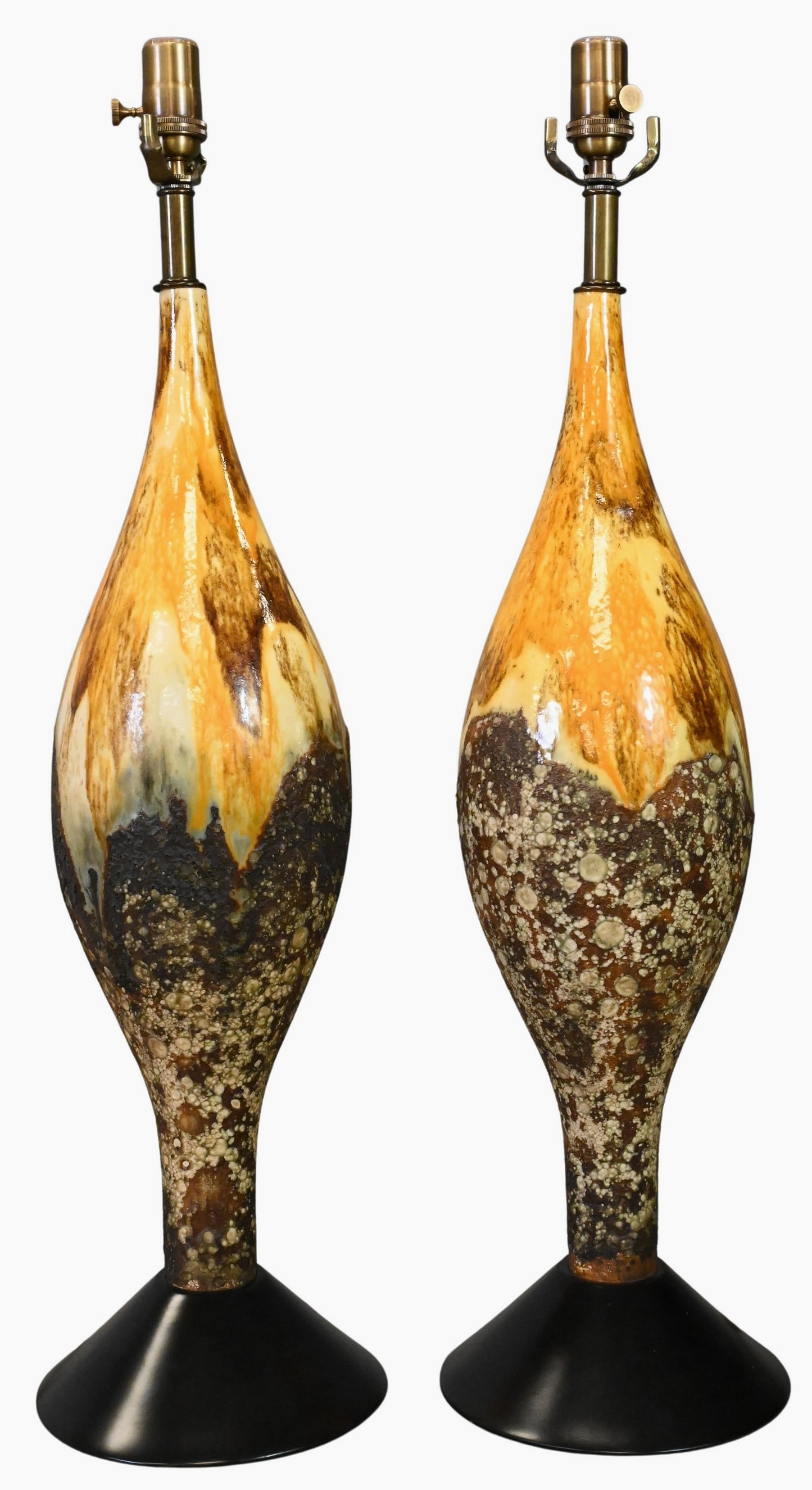 Pair of Mid Century Volcanic Glaze Ceramic Table Lamps: Pair of Mid Century Volcanic Glaze Ceramic Table Lamps Each having a large ceramic body featuring a textured volcanic glaze surface, adjustable polished brass double cluster sockets Height to top of
