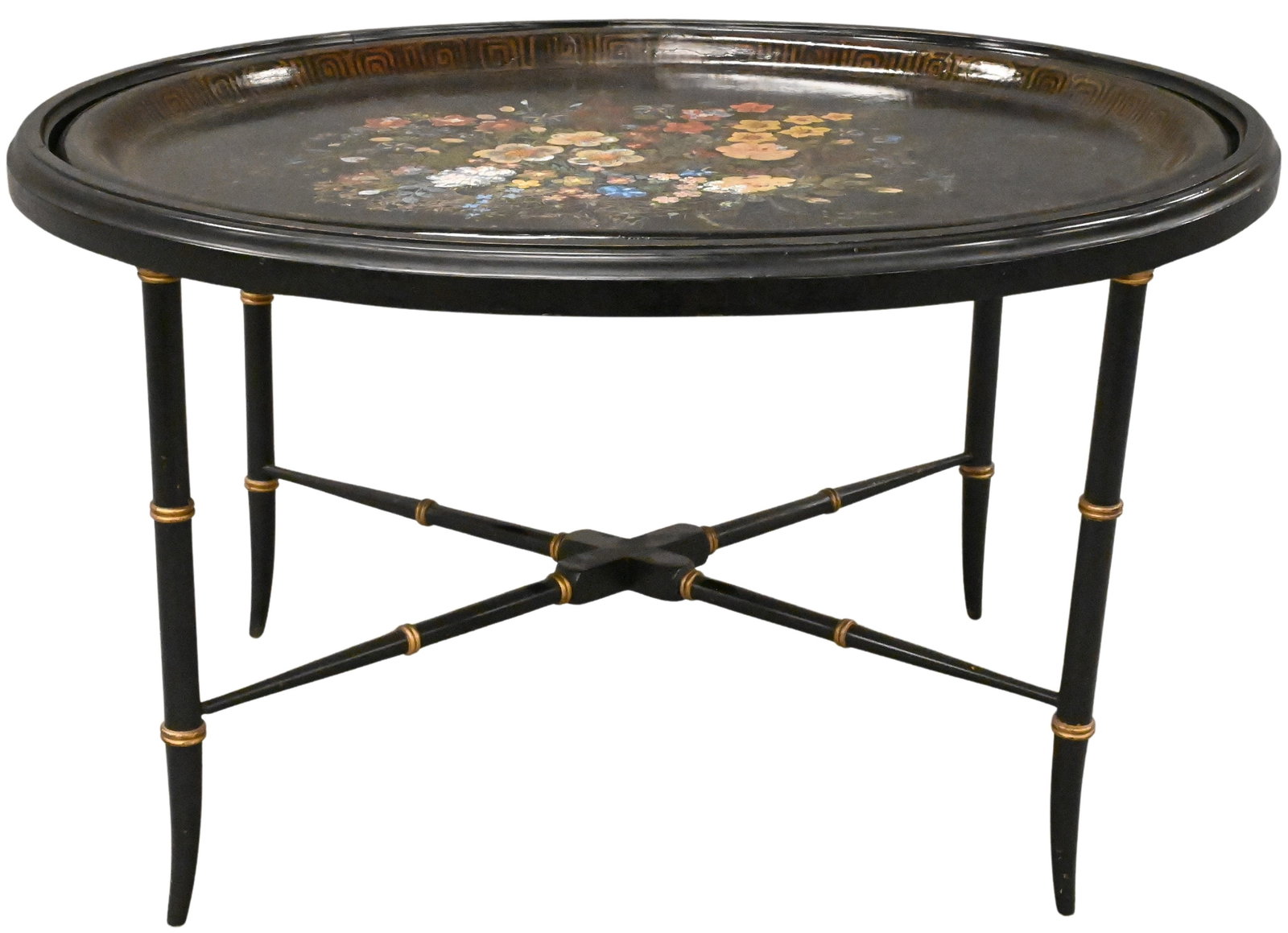 Black Painted Floral Tray Table: Black Painted Floral Tray Table Oval tray top having gilt and polychrome floral decoration, raised on cross bar faux bamboo supports height 18 inches, top 26" x 32"