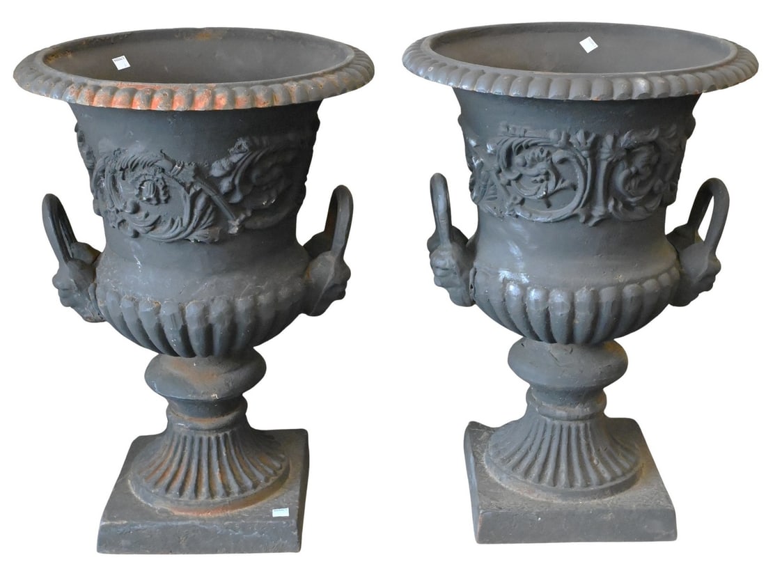 Pair of Victorian Outdoor Cast Iron Urns: Pair of Victorian Outdoor Cast Iron Urns each having flared rim over two bands and terminating in a fluted base height 24 inches, diameter 17 inches