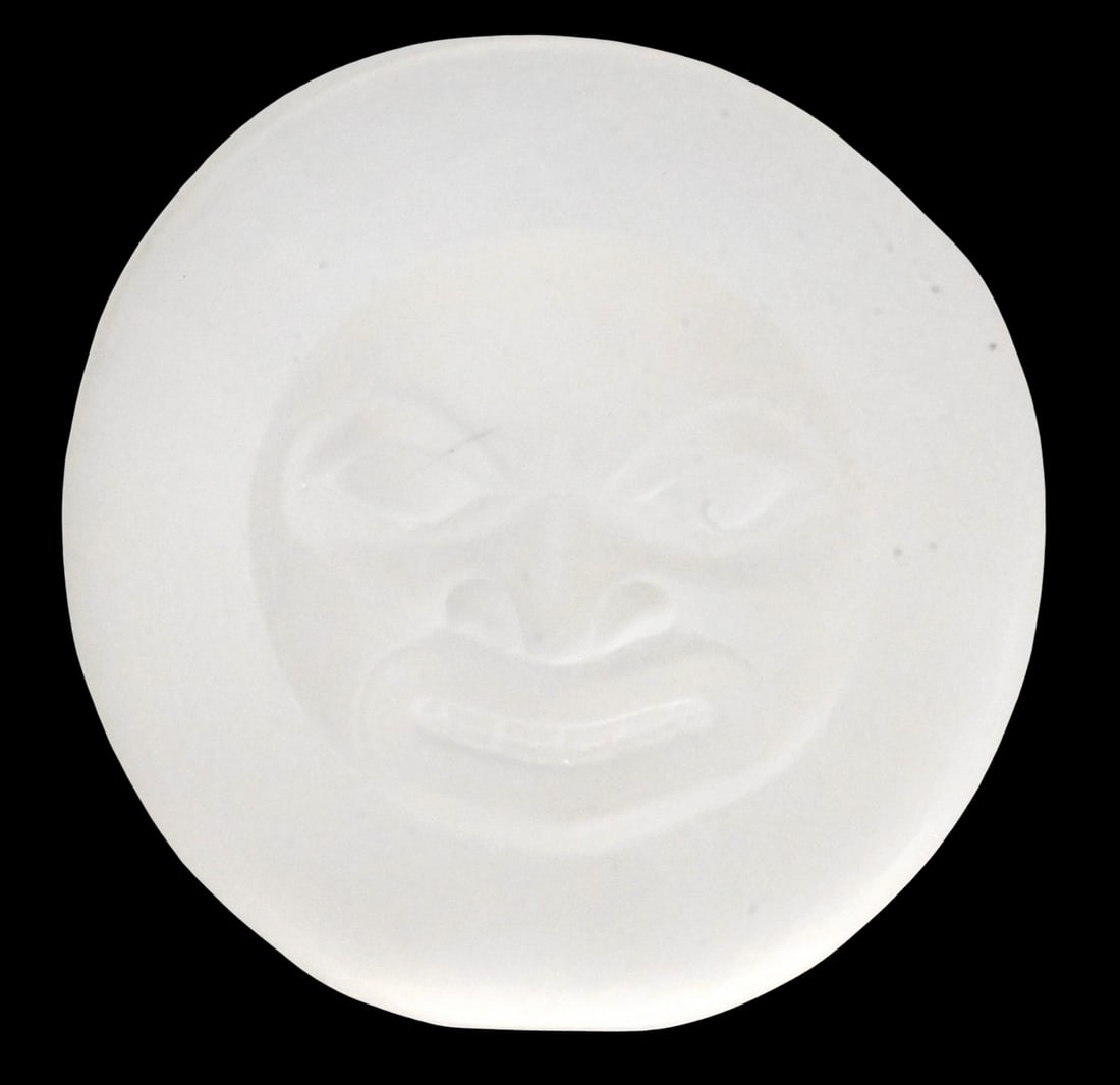 Preston Singletary (Native American/Tlingit, B.1963): Preston Singletary (Native American/Tlingit, B.1963) "Moon Mask", 2021 Sandblasted glass mask depicting a stylized moon face Signed and dated P. Singletary 2021 4 1/4" x 4" Provenance: Property from