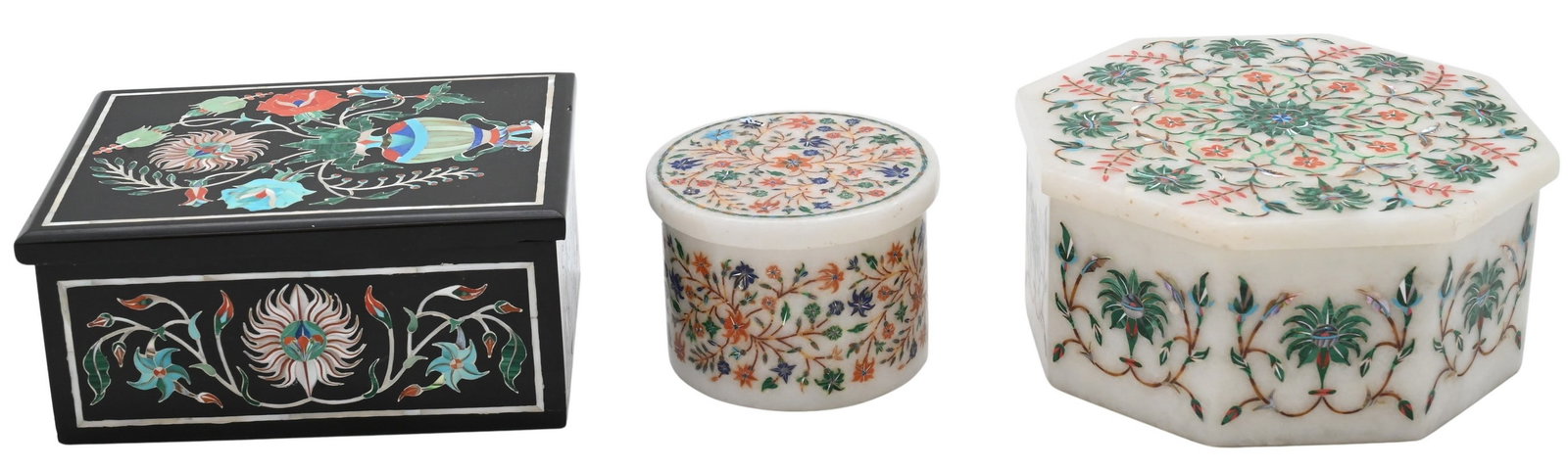 Three Indian Pietra Dura Jewelry Boxes: Three Indian Pietra Dura Jewelry Boxes Including two white marble boxes, one octagonal and one circular, each featuring floral hardstone inlay, together with a rectangular black stone example in the
