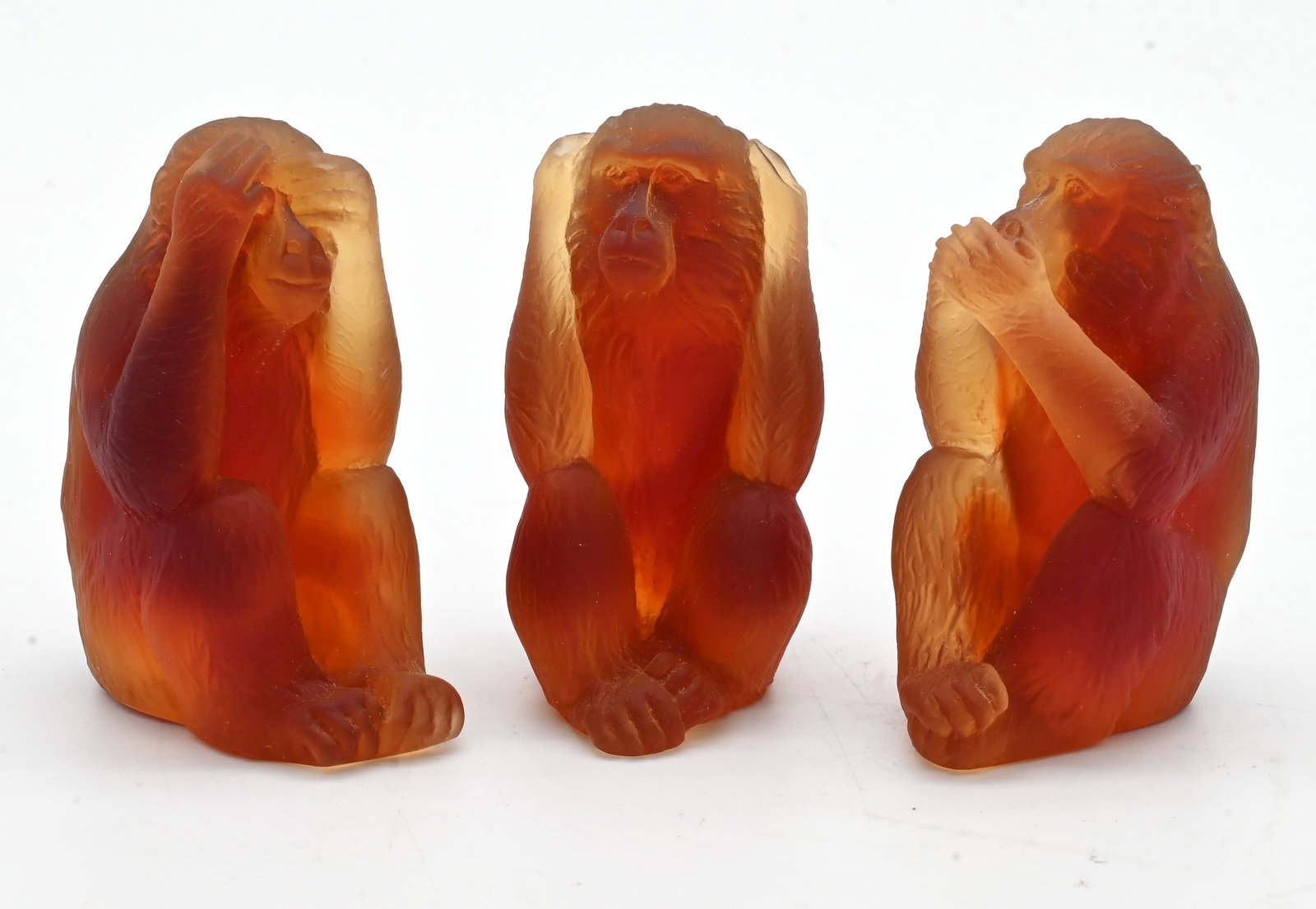 Set of Three Daum Pate-De-Verre Glass Monkey Figurines: Set of Three Daum Pate-De-Verre Glass Monkey Figurines in amber glass depicting Hear, See, Speak No Evil. Etched Daum, France to bases height 3 1/2 inches Provenance: Property from a Park Avenue New