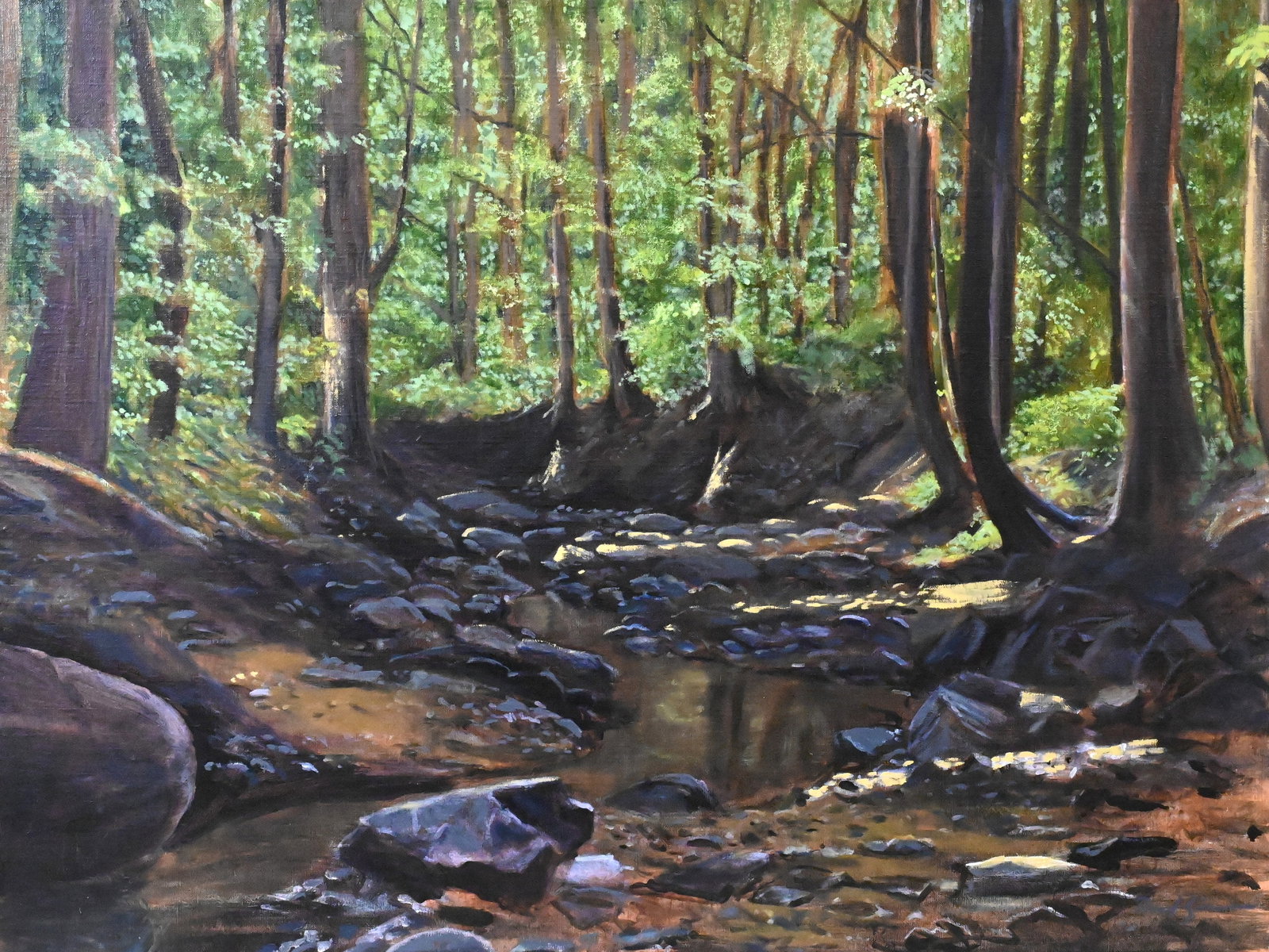 David Zimmerman (American B.1946): David Zimmerman (American B.1946) "Zachary Taylor Run: Summer" A tranquil woodland landscape, with dappled light filtering through the trees and illuminating the stream below Oil on canvas Signed