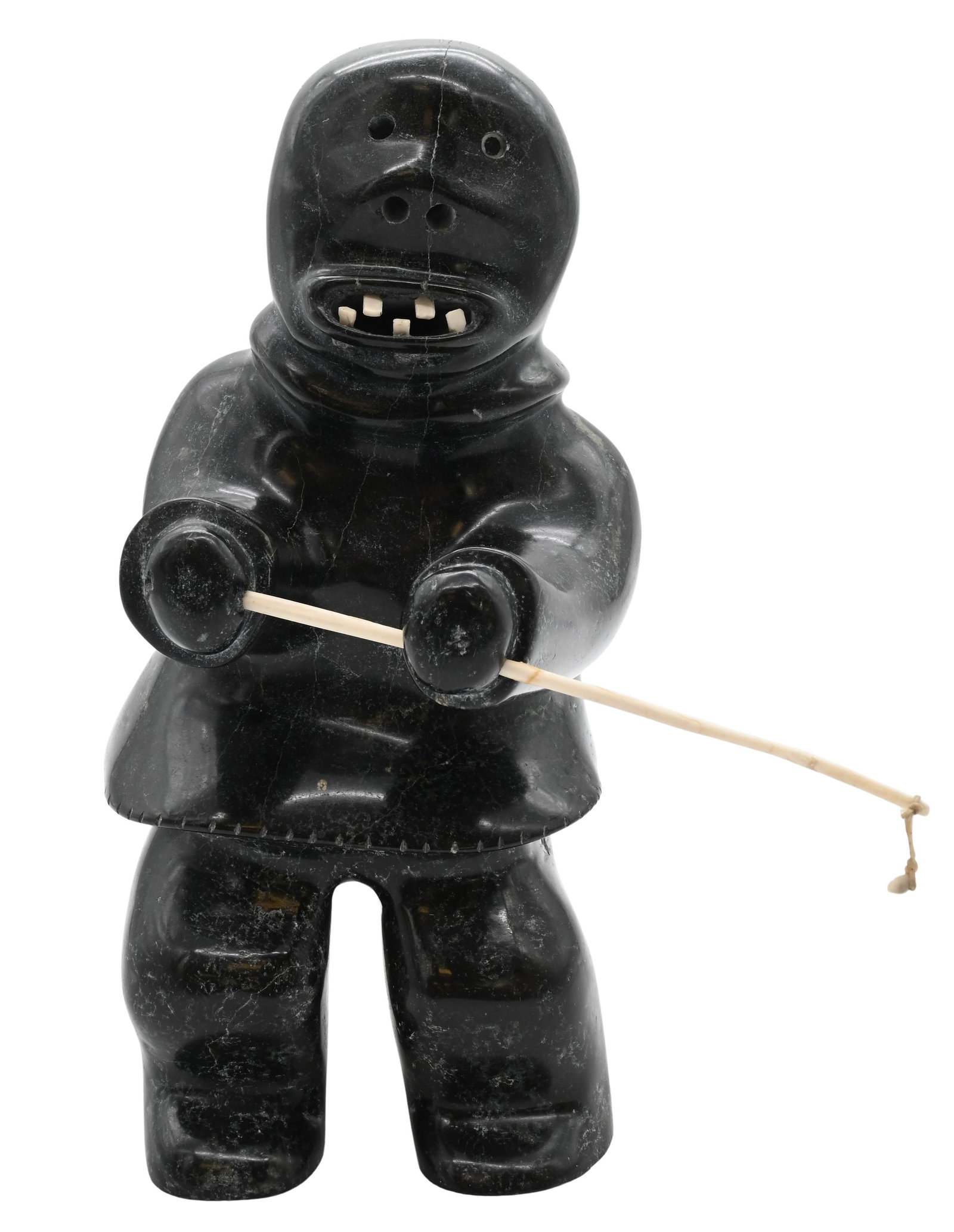 Attributed to Nelson Takkiruq (Canadian Inuit, Gjoa Haven 1930-1999): Attributed to Nelson Takkiruq (Canadian Inuit, Gjoa Haven 1930-1999) Fisherman Holding a Fishing Pole Carved soapstone figure Iglo Tag Trademark and carving number 8821-281 to underside Height 12 1/2 