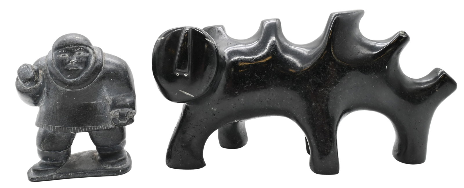 Two Inuit Soapstone Carvings: Two Inuit Soapstone Carvings to include George Arluk (Canadian Inuit 1949-2023) Spirit Transformation, 1996 Carved soapstone figure Signed and dated to underside George Arluk 1996, signed in